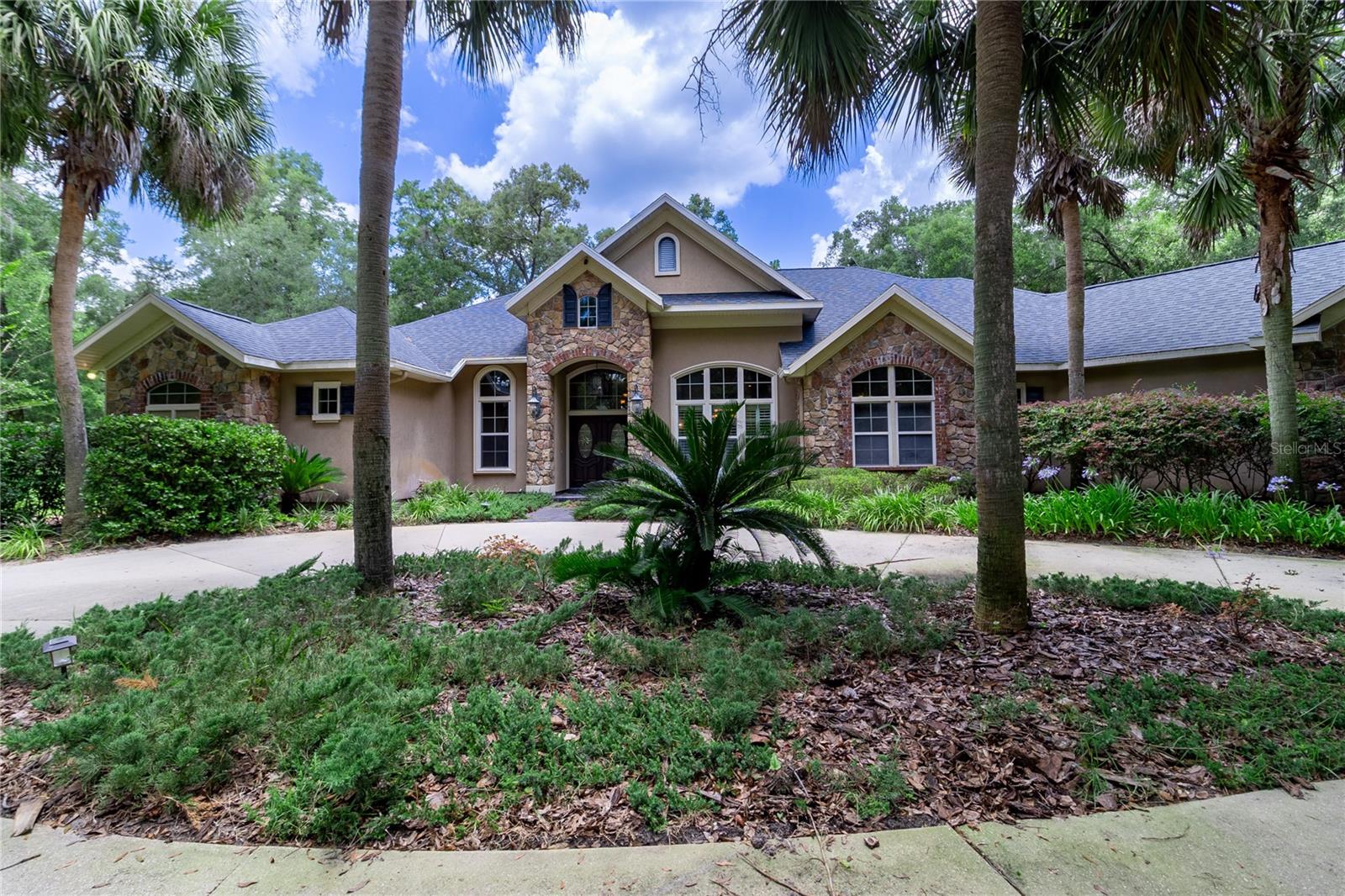 Executive Gainesville Rental: Custom 4 Suite Home on 2.43 Acres with Private Pool & Gourmet Kitchen
Experience unparalleled luxury and privacy in this sprawling custom estate, situated on 2.43 acres of pristine land. This executive home offers everything you need for cultured living and entertaining, featuring:
4 Bedrooms and 4.5 Bathrooms, Two Studies: Ideal for a home office, library, or dedicated workspace.
Elegant Formal Living and Dining Rooms: Perfect for hosting intimate gatherings or grand celebrations.
Great Room & Breakfast Nook: Providing flexible space for everyday living and casual dining.
Executive Chef's Kitchen: Designed for culinary enthusiasts, featuring a commercial-grade gas range, custom Bordeaux maple cabinets, luxurious golden wave granite countertops, and top-of-the-line stainless steel appliances.
Master Suite Retreat: A serene escape complete with a two-sided fireplace, bay window with pool views, tray ceiling with cove lighting, surround sound, jetted tub, and a massive walk-in closet area.
Stunning Finishes: Enjoy the beauty and durability of travertine tile and antique rustic plank wood floors throughout, along with extensive crown moldings.
Enjoy your outdoors all year with your 2000+ sq ft of Outdoor Bliss: An expansive and versatile area for relaxation, entertainment, and enjoyment of the Florida weather. Screened Saltwater Pool and Spa, Fire-Pit and Resort-Style Full Summer Kitchen & Bar: Perfect for alfresco dining and entertaining guests with ease.
Enjoy seamless connectivity and high-quality audio throughout the home with surround sound.
Sprinkler System: Maintaining a lush and beautiful landscape with ease.
Generator: Providing peace of mind during power outages.
Wireless Remote/Panel Controlled Free-Form Pool: Effortless control of your pool and spa.
Enjoy complete perimeter cross-fencing and a gated entrance for added security and exclusivity.
Circular Driveway & 3 Car Garage leaves room for residents and hosting guests.
Schedule your private tour today and reserve this estate for yourself!