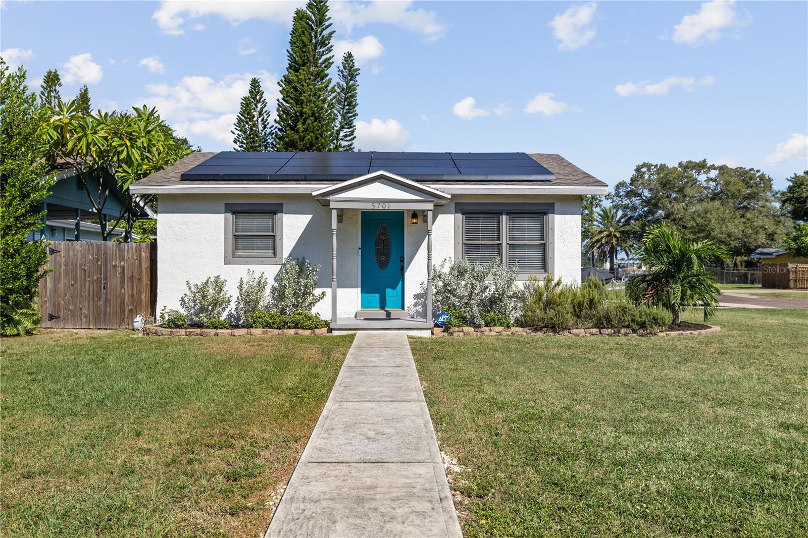 On a premium corner lot, this updated three-bedroom, two-bath Gulfport home offers a rare blend of modern systems, energy efficiency and indoor-outdoor living. With 1,456 square feet of refreshed interior space, nearly every major component has been permitted and upgraded, including 2023 full plumbing replacement, 2020 roof, tankless water heater, new solar panel system, updated air conditioner and ductwork, and a 2021 fenced yard for added privacy. X-flood zone (no flood insurance required). Inside, the home features all-new luxury vinyl plank flooring, fresh interior paint throughout and a bright, seamless layout. The renovated primary suite includes dual vanity and updated finishes, and a new washer/dryer (installed May 2025) adds convenience. Smart home features include a Nest camera system and ADT security with motion sensors, plus upgraded weatherproofing for energy efficiency. Outdoor living is a highlight with two Trex side terraces, an entertainment deck with gas fireplace, covered patio, gazebo, and a dedicated storage shed, all set within a fully fenced yard with room to relax, garden or entertain. Turnkey, solar-enhanced, and thoughtfully updated, this Gulfport property is a standout opportunity with major improvements completed and ready for immediate enjoyment. Don’t miss your dream corner lot getaway!