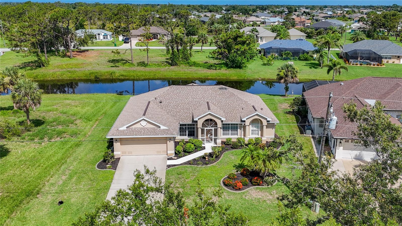 Available Now Until October 2025!
Welcome to this beautifully refreshed canal-facing villa in the tranquil Rotonda West community! This 3-bedroom, 2-bathroom home features a thoughtfully designed split floor plan, offering both privacy and an easy flow for everyday living. Fully stocked with everything you need, this home is ready for a quick move-in — just bring your bags and settle in!
As you step inside, you'll find a formal dining room to the left and a cozy formal living/sitting area to the right, offering an inviting and elegant introduction to the home. Moving further in, the space opens up to a spacious, central living area—perfect for relaxation or entertaining. To the left is the fully equipped kitchen with all the essentials, a breakfast bar, and a casual dining nook. This area flows naturally toward the second bedroom and the office, providing a comfortable separation for guests or family members.
The split floor plan places the master suite on the opposite side of the home for added privacy. It features a queen-size bed, an en-suite bathroom, and a TV. The second bedroom also has a queen-size bed and TV. The third bedroom is designed as an office, offering a functional space for remote work or study.
The screened lanai provides serene canal views, making it a peaceful spot to enjoy your morning coffee or unwind at sunset. The backyard includes a grill and outdoor dining area, perfect for gatherings or al fresco dining.
Fully stocked with linens, kitchenware, and other living essentials, this home ensures a smooth and seamless move-in. Located close to beaches, golf courses, and shopping, it’s ideal for those looking to enjoy all that Rotonda West has to offer.
Book your stay today and enjoy this move-in-ready retreat, available now until October 2025!