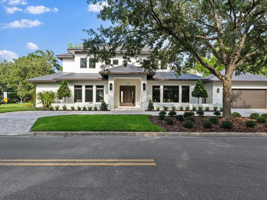 Brand new construction!! Ready to move in! A stunning modern transitional home located in the heart of Winter park minutes from Park Ave. As you enter this home through the large double door entryway you are greeted with a expansive open floor plan and a stunning floating staircase. The open space encompasses, a modern kitchen, great room, dining room, and living/flex room lending itself to large and small conversational areas. The space further opens up through the 30 ft stackable glass doors that opens up to a large lanai with tongue and grove ceiling, lap pool, and summer kitchen. Offering you the best of indoor and outdoor living. The primary suite located on the main floor has a incredible walk-in closet outfitted for the most discerning homeowner leading to a luxurious bathroom. The laundry room and powder bath are tucked near the air conditioned 2 car garage offering a great drop zone area and privacy. As you ascend up the floating staircase you are welcomed into a cosy loft space with 3 en-suite bedrooms with one being a large junior suite. No need to wait for your new custom home offering the best schools, shopping, and lifestyle. This house is move in ready for you to call home.