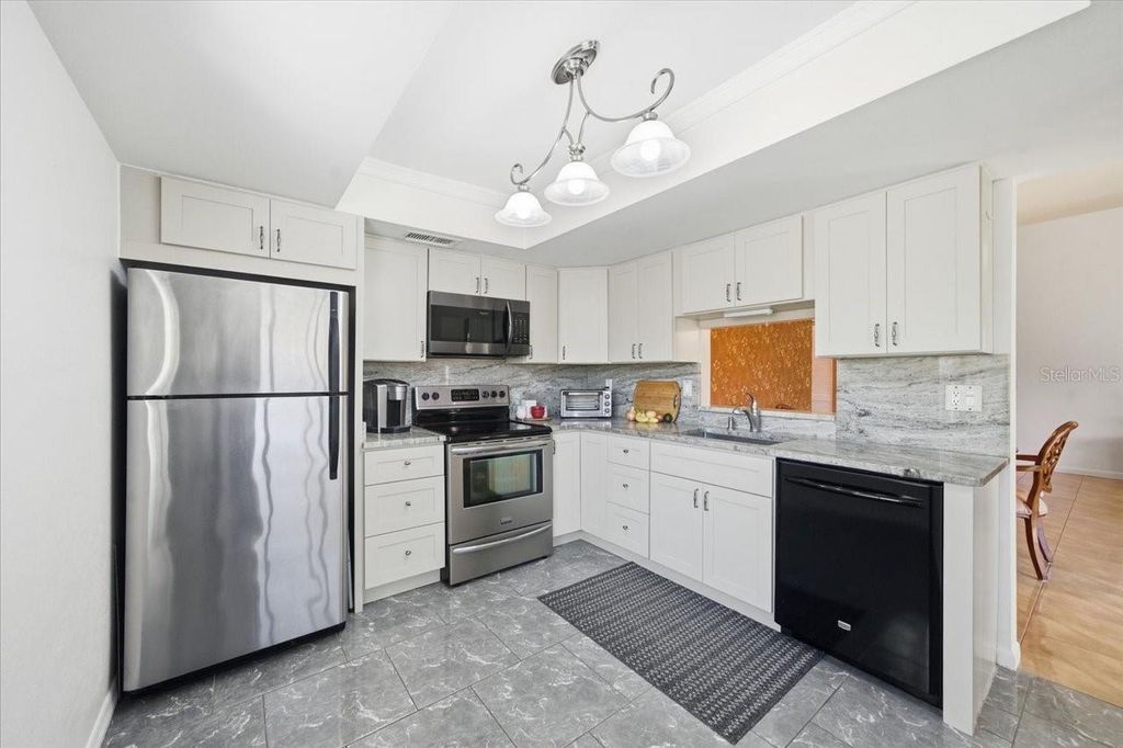 Photo of 2582 Forest Run Court #105A, Clearwater, FL 33761 (MLS # TB8472825)