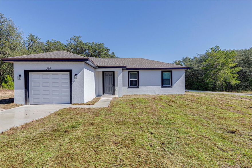 Conveniently located between Ocala and Orlando, with easy access to major highways. Perfect opportunity to build your dream home, retirement residence, or investment property at an affordable price in a growing area of Central Florida. 

Enjoy the peaceful surroundings of nature while being close to world-class golf courses, restaurants, hospitals, and events from The Villages community.

This beautifully designed 3-bedroom, 2-bathroom home offers 1,292 sq. ft. of living space. The open-concept floor plan features high ceilings, elegant wood-look tile flooring throughout, and abundant natural light that enhances the modern interior.

The kitchen is equipped with stainless steel appliances, quartz countertops, and a spacious island perfect for cooking or entertaining. The master suite includes a walk-in closet and a private bathroom with dual vanities and a beautifully tiled walk-in shower.

Enjoy peace and privacy with no rear neighbors and a large open backyard — ideal for relaxing or outdoor gatherings. Located just minutes from Lake Weir, shopping, and dining options, this home offers the perfect blend of comfort, style, and convenience.
Move-in ready and waiting for its first owner!