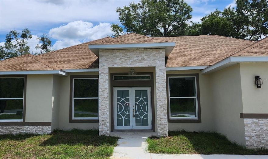 Beautiful 4-bedroom, 3-bathroom home situated on a spacious 0.24-acre lot.  This newly constructed Beautiful
Big Spacious 1887 sqf, 3 bedroom, 2 baths, 2 car garage. House is full of XTRAS, Lots of UPGRADES.
Luxury Tile flooring throughout your Dream Home! Beautiful kitchen with solid wood cabinets, with granite
waterfall island, granite countertops, stainless steel appliances, Big kitchen counter island and farmers sink.
Cathedral ceilings, Extra light throughout the house. Upgraded Beautiful fans in every room, Big tall luxury
doors at every room. French doors in the Main bedroom and living room. Home perfectly decorated with great
finishings throughout the home. 2 PATIOS. Master bathroom, guest bathroom and all windows have granite.
Walk in closet