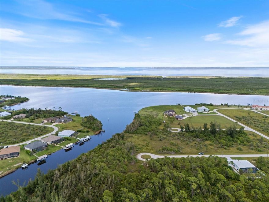RARE OVERSIZED 80’ SAILBOAT-ACCESS WATERFRONT LOT WITH GREENBELT | SOUTH GULF COVE | NO BRIDGES TO THE GULF.

This is the one buyers wait years for.

Welcome to an extraordinary waterfront sanctuary in the highly sought-after Section 94 ONLY Waterview Property Owners Association of South Gulf Cove—where luxury, privacy, and true Gulf access converge. Offering over 14,700 square feet PLUS an additional POA-owned greenbelt buffer behind the lot, this property lives significantly larger than it appears and delivers unmatched space, exclusivity, and breathtaking water views.

With 80 FEET OF PRIME WATERFRONT, this exceptional homesite provides generous dock potential and the ability to accommodate sailboats and larger vessels with ease.

Positioned on the Staunton Waterway, a deep-water canal just feet from Interceptor Lagoon, this homesite offers direct sailboat and large-vessel access to Charlotte Harbor and the Gulf of America with NO FIXED BRIDGES. From your future backyard dock, you can be cruising open water within minutes. Sunset cruises. Offshore fishing. Weekend island hopping. Your boating lifestyle begins the moment you launch.

Northwestern rear exposure ensures spectacular sunset skies reflecting across wide water views while providing ideal light across your future lanai and pool. The tranquil backdrop enhances privacy and creates a serene, natural setting rarely found with true sailboat-access parcels.

Located in one of the most desirable boating corridors in Port Charlotte, this section is surrounded by custom waterfront estates—many exceeding $1M+. New luxury homes continue to rise, reinforcing long-term value and prestige. Very few parcels offer this combination of lot size, 80’ of water frontage, deep-water access, and greenbelt advantage.

Public water and sewer are already in place, with electric nearby—making this the perfect canvas for your custom coastal retreat. Builder plans are available to bring your vision to life.

South Gulf Cove offers:
• Community boat ramp
• Five waterfront parks with fishing, playgrounds & walking paths
• Golf cart-friendly streets
• Optional HOA membership ($130/year) with social events, dinners, and boat & golf cart parades. 

Only 20 minutes to Boca Grande and Manasota Key beaches. World-class fishing awaits just offshore where the famed tarpon tournaments take place. Quick access to shopping, dining, and everyday conveniences.

This is more than a lot.
It is a lifestyle investment.
A boating legacy property.
A disappearing opportunity.

Secure your slice of Gulf-access paradise before it’s gone.