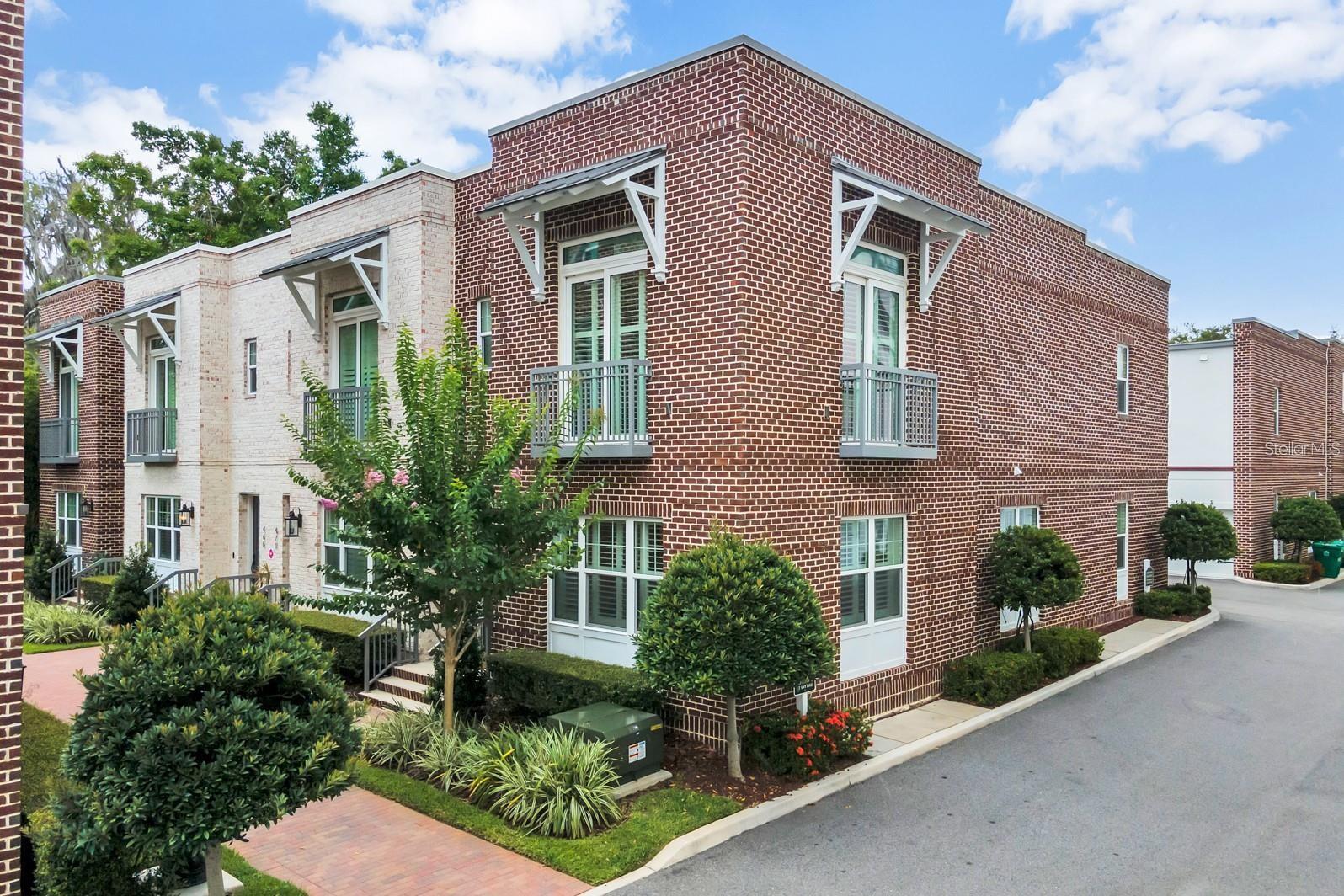 MOVE-IN READY! Modern, fully furnished luxury townhome in the highly sought-after Park Place community of Winter Garden! This stunning 3-bedroom, 2.5-bath residence with a 2-car garage offers upscale living just steps from charming Downtown Winter Garden. This thoughtfully designed two-story layout features: First floor: Two spacious bedrooms connected by a Jack-and-Jill bathroom, a linen closet, laundry area, and additional storage. Main level: An open-concept living room and chef-inspired kitchen, perfect for entertaining. The kitchen boasts a large island with breakfast bar, elegant wood cabinetry, stainless steel appliances, designer pendant lighting, and a sleek range hood. Upper level: A private owner’s retreat complete with a generous walk-in closet, a private balcony, and a spa-like ensuite bath featuring a double vanity, frameless glass shower, soaking tub, and upgraded fixtures. All of this near to Plant Street Market, boutique shopping, fine dining, and year-round community events. Don’t miss your chance to live in one of Winter Garden’s most desirable locations—schedule your private showing today!
