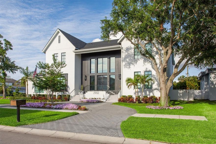 Step into architectural excellence built by Baywalk Custom Homes with this stunning 6,305 sq ft, 5-bedroom, 6-bathroom custom estate, theater room, and a den, ideally situated just under a half-acre in one of the area's most coveted locations in Tampa.
 A grand foyer sets the tone with a dramatic 22-foot foyer ceiling, featuring a dual floating staircase, elevator, and glass railings inside and out that make an unforgettable first impression. Throughout the home, elegant Venetian plaster rooms and accent walls add warmth and texture, seamlessly blending contemporary design with timeless sophistication.
 At the heart of the home is a true culinary dream—a gourmet kitchen complete with dual islands, a hidden walk-in pantry, and a fully equipped chef's kitchen featuring top-of-the-line Thermador appliances, a wine column, two dishwashers, and a built-in coffee maker. It's the perfect space for entertaining or everyday living.
 The soaring 22-foot ceilings continue into the expansive family room, creating a bright, open living space with endless possibilities for hosting or relaxing in style with tons of natural light from the oversized windows.
 Every element of convenience has been considered, from the elevator providing easy access between floors. The downstairs laundry rooms feature a custom dog bath. The home has a mudroom and a Control4 smart home automation system that further enhances daily functionality.  The luxurious master suite is a private retreat, highlighted by a spa-inspired master bathroom with sauna, offering a true escape within your home.  Step outside to your resort-style backyard, with an expansive lanai and outdoor kitchen. This home also includes a pool, sun shelf with in-pool loungers and spa, turf, tropical landscaping, a custom putting green, and hidden roll-down screens on the lanai for seamless indoor-outdoor living. A full-yard automated mosquito system ensures uninterrupted enjoyment year-round.  Car enthusiasts will appreciate the oversized 5-car garage with a lift, perfect for additional storage or showcasing your collection. The home's exterior includes landscape lighting and a Holiday Trim light system; your home will shine with customizable lighting for every holiday or celebration.
 The home is offered furnished.