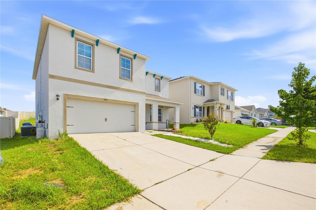 Photo of 233 Ludisia Loop, Davenport, FL 33837 (MLS # TB8556995)