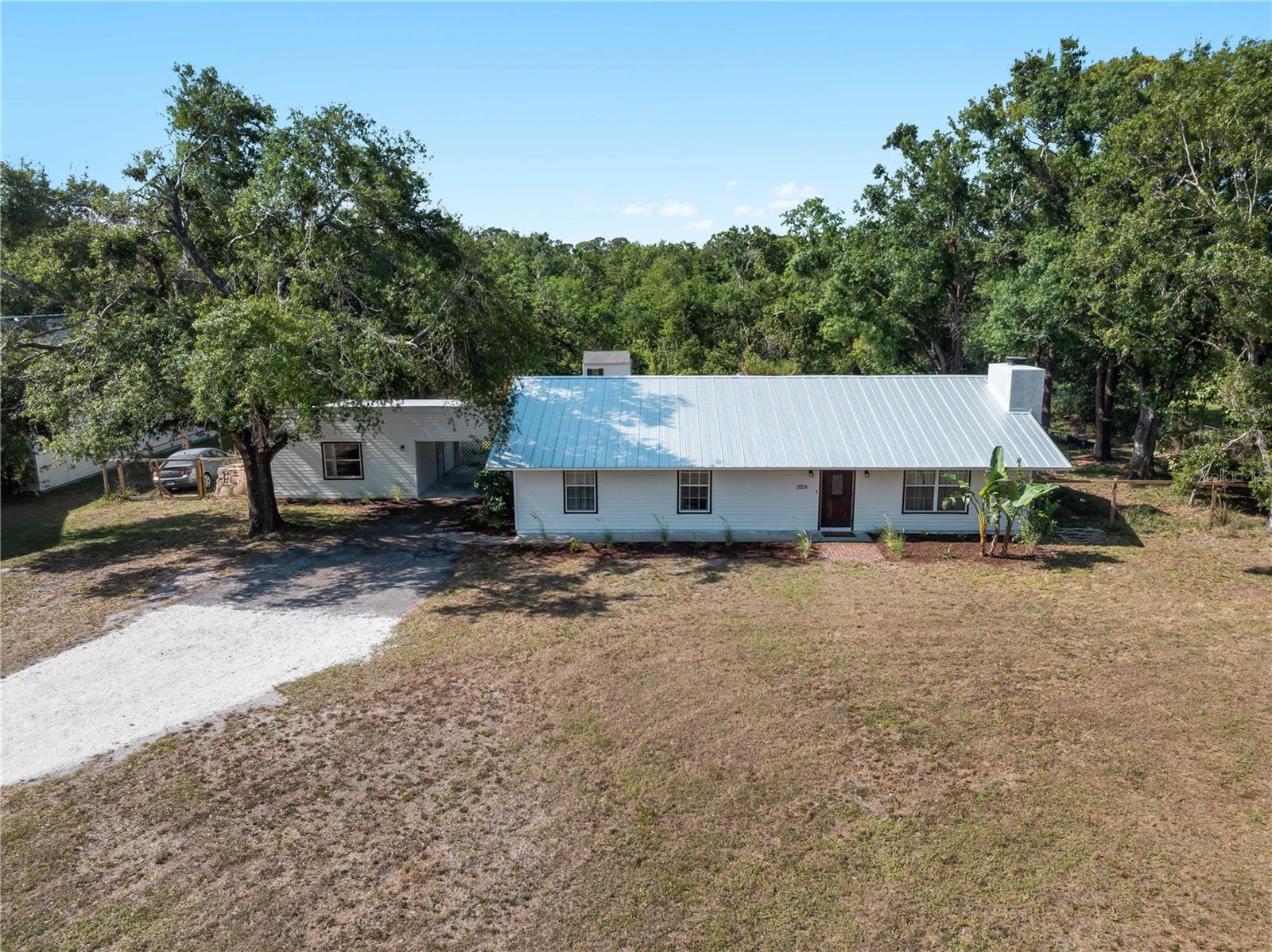 BACK ON THE MARKET AT NO FAULT TO THE HOME - buyer's home sale contingency was not met. Charming Updated 3 Bedroom Home with Income Potential on a Peaceful Acre - Partially Furnished! Welcome to this beautifully updated 3-bedroom, 2-bath home tucked away on a quiet dead-end street. Sitting on almost a full acre of land, this property offers space to grow and create, and great opportunity to utilize a 1-bedroom, 1-bath secondary suite to fit your needs. All with the bonus of coming partially furnished, so you can settle in with ease.
Inside the main home, you’ll find an inviting layout with tasteful updates throughout — including a completely renovated kitchen, updated bathrooms, and a spacious living area filled with natural light and equipped with a cozy wood burning fireplace. The dining area features glass French doors with serene views of the expansive backyard that backs up to a wooded property. A new metal roof was installed in 2024, and new HVAC in 2023.
But that’s not all — this property also includes a fully equipped 1-bedroom, 1-bath *secondary suite* with its own entrance and kitchen, it is perfect for multigenerational living, guests, or rental income. There is also a private covered patio for guests to enjoy.
Outside, the shy of one-acre lot is a blank canvas ready for your vision. Whether you dream of a lush garden, workshop, pool, hobby farm, or simply wide-open space to enjoy, the potential is endless. Multiple persimmon trees and other fruit trees are already established on the property to enjoy immediately.
Enjoy the peace and privacy of country-style living while still being conveniently close to town amenities. Don’t miss your chance to own this unique and versatile property!