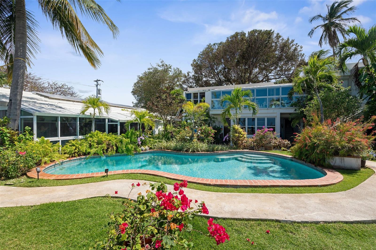 This spectacular ocean front property located at the end of a private, gated block is a gem among gems with nearly 1/4 acres of land and 140+ feet on the water. 5400+ square feet of construction in an undeniably perfect layout to maximize views and openness, this property currently operates with some rental units and a main residence that can easily continue to generate income or be remodeled into one of San Juan's most spectacular waterfront homes. This is one of less than 20 beachfront lots of its kind anywhere in the metro area, and they're never for sale. One of a kind, strategically located for maximum privacy and convenience, this is the compound with ocean views from everywhere you've been dreaming of. Call today for a private tour!