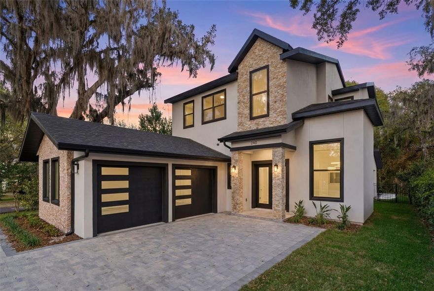 Brand new construction luxury home in the heart of Winter Park! This stunning two-story custom residence offers nearly 3,000 sq ft of heated living space with 5 bedrooms and 4 1/2 bathrooms. A soaring two-story foyer creates a dramatic first impression and opens into an expansive great room featuring 12-foot ceilings, wide-plank flooring, and abundant natural light. The family room showcases a custom paneled feature wall with a sleek built-in electric fireplace, creating a striking focal point for the space.
The gourmet kitchen is designed for both everyday living and entertaining, highlighted by a large center island with seating, European slab cabinetry, premium hardware, designer countertops, and high-end appliances. Ample storage and a clean modern aesthetic make this kitchen as functional as it is beautiful. Tucked beneath the staircase is a custom wine storage feature, adding a unique luxury detail.
The first floor also includes a private guest suite with its own en suite bathroom, perfect for visitors or multi-generational living. A dedicated home office provides a quiet workspace, while the main-floor laundry room adds convenience. Outside, a professionally designed outdoor kitchen extends the living space and creates the perfect setting for year-round entertaining under the Florida sky.
Upstairs, the luxurious primary suite serves as a private retreat. The spacious walk-in closet features a fully custom organization system, while the spa-inspired primary bathroom includes a dual-sink vanity, elegant freestanding soaking tub, and oversized walk-in shower with premium tile work.
Three additional bedrooms complete the second floor. Two share a beautifully appointed Jack-and-Jill bathroom, while the fourth bedroom features its own private en suite bath, offering flexibility for guests or family members.
Located at 240 N. Phelps Avenue, this home places you just minutes from Winter Park’s iconic Park Avenue — a vibrant destination known for its boutique shopping, award-winning restaurants, art galleries, and charming sidewalk cafés. Residents enjoy access to top-rated schools, including Winter Park High School, as well as renowned cultural destinations such as the Morse Museum of American Art and the Polasek Museum. Outdoor lovers will appreciate nearby Central Park, Mead Garden, and the scenic Winter Park Chain of Lakes.
Conveniently located near I-4, SR-417, downtown Orlando, Lake Nona Medical City, UCF, and Orlando International Airport, this home offers the perfect balance of luxury, convenience, and the timeless charm that makes Winter Park one of Central Florida’s most sought-after communities.
Schedule your private showing today.