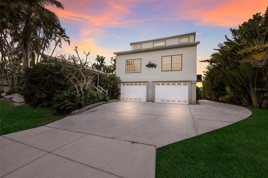 Welcome to island time on Terra Ceia Island—where life slows down, the water is always calling, and every day feels like a getaway. 
For boating enthusiasts, this property is the ultimate setup. Situated on a canal with a private dock, private boat ramp, and 8,000-lb lift, this home was designed for spontaneous adventures. No trailering. No waiting. Just drop the boat and go—whether it’s fishing, cruising the bay, or heading out to the Gulf. This one-of-a-kind Key West–style home was made for buyers who want something different… something with personality, views, and a direct connection to the boating lifestyle. The first level offers a generous garage and storage space for all the essentials of island living—boats, bikes, fishing gear, and everything you need to be on the water at a moment’s notice.
Upstairs on the second floor, the main living area is light, bright, and welcoming, with a relaxed energy that instantly makes you feel at home. Just off the living space is a large covered, screened-in porch—the kind of spot you’ll use year-round for dining, relaxing, and catching those glowing west-facing sunset views while enjoying the coastal breeze without the elements. A guest bedroom and bath complete this level, making it comfortable and functional for everyday living or hosting visitors.
Then comes the showstopper—take the spiral staircase up to the third floor, where you’ll find a private retreat featuring the primary suite, an additional guest bedroom, and elevated views that feel like you’re floating above it all. From here, you can soak in the unobstructed sightlines of the iconic Sunshine Skyway Bridge, creating a backdrop that changes by the hour with sunsets, passing boats, and open sky.
And while the home itself is special, the lifestyle here is what truly sets it apart. Terra Ceia is known for its active, close-knit community where residents spend their days biking, walking, and enjoying the outdoors. A local fruit stand and quaint post office add to the island’s old-Florida charm. Seabreeze Park offers members access to pickleball courts, a playground, covered pavilion, and a boat ramp—all surrounded by the beauty of Terra Ceia Bay.  
If you’ve been searching for a home that delivers not just a place to live, but a true waterfront lifestyle—with unforgettable views, effortless boating, and a welcoming island community—this is where your story begins.