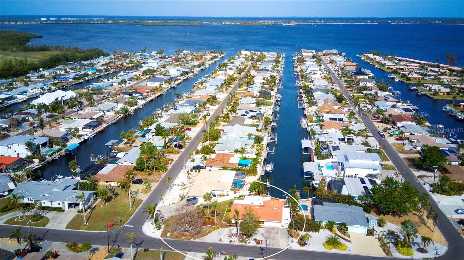 Back on the market! Buyer's financing fell through. Their loss is your gain. :) Welcome to this stunning waterfront home in the sought-after San Remo Shores Boating Community—a true boater’s dream! Situated on deep sailboat water with no bridges to the Gulf, this home offers direct access to Sarasota Bay and the Gulf of Mexico, making it ideal for water enthusiasts. This impressive property boasts over 2,000 sq. ft. of living space, featuring 4 spacious bedrooms, 2 baths, and ample storage throughout. A blank canvas, this home invites you to infuse your own design touches and personal style. Some of the key features are updated kitchen and primary bath with granite countertops, and recessed lighting. The home has hurricane shutters, and added protection for the garage door, and a durable tile roof. There is a spacious garage with parking for 2 cars and a circular driveway for plenty of extra parking. For your outdoor living enjoyment there is an expansive screened lanai perfect for enjoying the breezes and tranquil water views. There are davits to park your boat right at your back door. Located just one mile from Anna Maria Island and it's sugar-sand beaches, this home also places you near the historic Cortez fishing village, known for its dockside seafood restaurants, charter boat fishing, and quaint shops. Conveniently close to IMG Academy and both Sarasota and Tampa airports, this is the perfect home for those seeking the best of Florida living. The seller is offering a home warranty with purchase. Don’t miss this rare Opportunity to own a slice of paradise!
Schedule your private showing today and discover this waterfront gem.