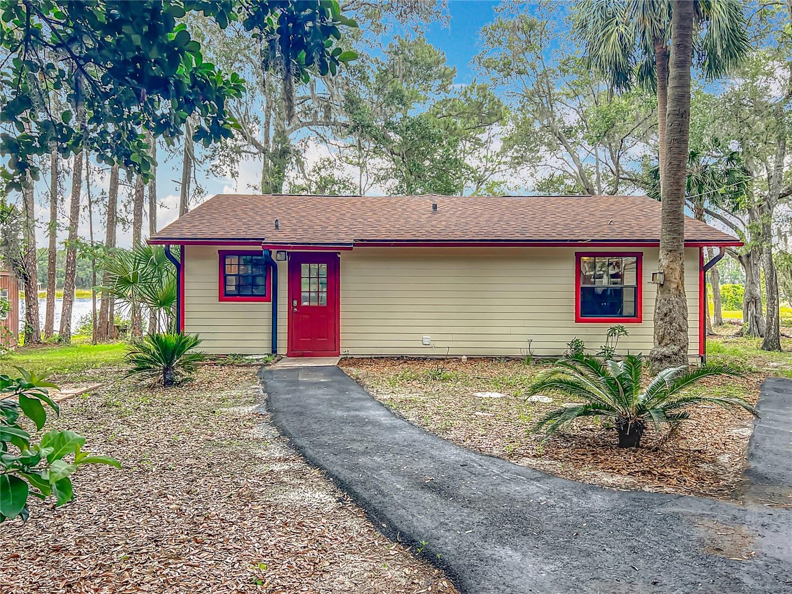 Peaceful Florida Retreat with Lake View | No HOA | Updated Roof 2025 & AC 2023 & Water Heater 2025
Welcome to your private slice of peaceful Florida living in the heart of the Woods & Lakes community. This charming 2-bedroom, 1-bath home offers nearly 1,300 square feet of inviting space on a generous **0.53-acre lot with tranquil lake views—**and best of all, no HOA! That means total freedom to live how you want, with room to spread out and enjoy your own waterfront haven.
Step inside to discover wood laminate and tile flooring throughout, brightened by natural light pouring in from every angle. The open layout gives the home a comfortable, laid-back feel that’s just waiting for your personal touch.
Big-ticket upgrades? Already done. A brand-new roof (Feb 2025) new AC system (2023) and Water Heater 2025 for the peace of mind for years to come. A freshly paved asphalt driveway leads to a covered carport, and there’s plenty of space to park your RV, boat, or extra vehicles.
Out back is where the magic happens—step onto your spacious 18.8' x 9.8' rear deck and take in the serene lake views right behind the home. Whether you’re grilling, entertaining, or simply sipping coffee as the morning mist rolls over the water, this space is pure Florida bliss.
You’ll also love the storage sheds on the property—perfect for your tools, toys, or hobbies. And the entire lot is framed by majestic oaks, pines, and lush natural greenery.
Just minutes from Lake Weir and the Ocala National Forest, this home offers that perfect blend of country charm, outdoor adventure, and modern convenience.
Whether you’re seeking a full-time residence, weekend escape, or a smart investment, this cozy lakeview gem is ready for its next chapter.
