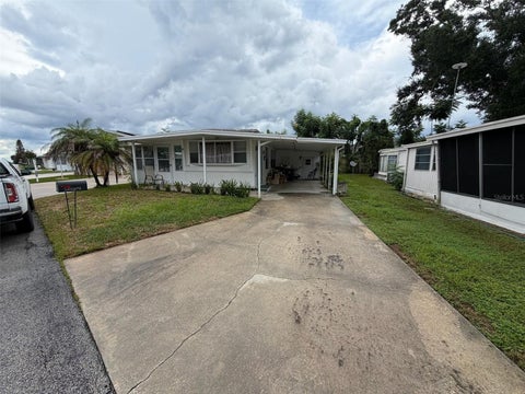 Photo of 112 Holiday Lane, Auburndale, FL 33823 (MLS # O6440504)