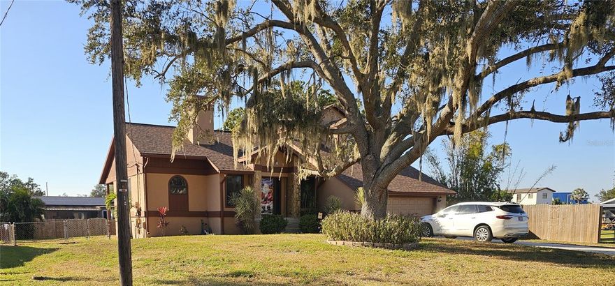 Lovely 2 story home, which makes it flood free in a neighborhood of waterfront homes.  Owner built home and raised his family there, so has some special features.  Fenced back yard, two car garage,  wood burning fireplace in Living Area.