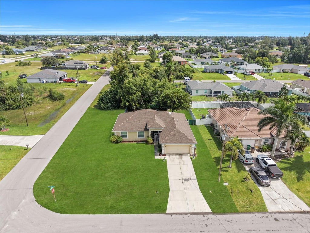 Photo of 1211 NW 27th Pl, Cape Coral, FL 33993 (MLS # TB8557698)
