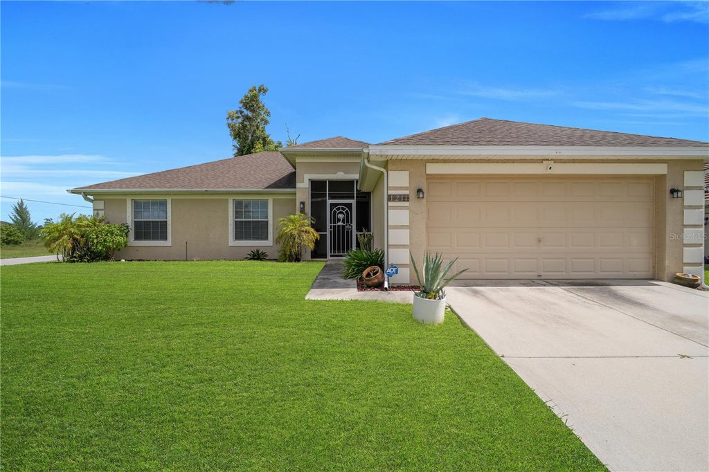 Photo of 1211 NW 27th Pl, Cape Coral, FL 33993 (MLS # TB8557698)