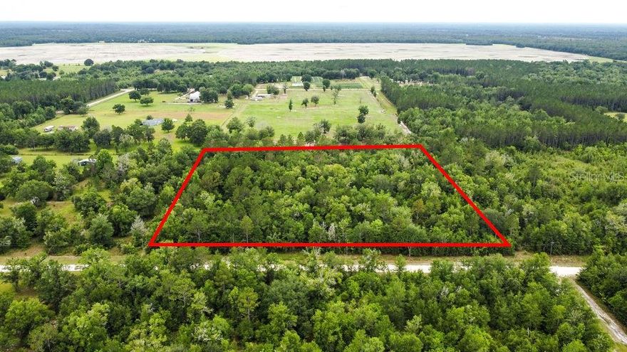 Bring your own builder to this little slice of heaven in Fort White, Columbia county Florida.  This 10.03 acre parcel is wooded and ready for your dream home or farm. The zoning permits certain agricultural uses such as farming and animal husbandry. 
The surrounding area is mostly rural with scattered homes and farms. The Ichetucknee Springs State Park, a popular destination for swimming, tubing, and kayaking, is located just a few miles to the south. The town of Fort White offers basic amenities such as grocery stores, gas stations, and restaurants.  Only 20 miles to Lake City and 32 miles to Gainesville. This parcel of land offers an opportunity to own a piece of rural Florida away from the hustle and bustle of town.