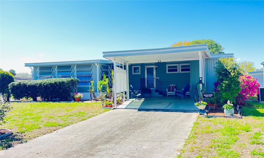 Welcome to easy Florida living in the desirable Molokai 55+ co-op community — where you own your share and enjoy low HOA fees packed with value!  This well-maintained home is ideally situated on a corner lot just steps from the community amenities, offering both convenience and added privacy. The affordable HOA includes water, sewer, trash, cable, and internet, along with full access to the community pool, shuffleboard courts, clubhouse with library, and a full calendar of social activities.  Inside, you’ll find a bright and inviting layout with abundant natural light throughout. The spacious primary suite features new carpet, dual built-in closets, built-in dresser drawers, and a private en-suite bath with a walk-in shower. The guest bedroom also offers new carpet, dual built-in closets, and built-in drawers — perfect for visitors or additional storage needs.  The main living areas were updated in 2023 with neutral luxury vinyl plank flooring, making it easy to complement any décor style. A large sunroom adds valuable extra living space — ideal for morning coffee, entertaining, or a hobby area.Major updates provide peace of mind, including new exterior paint, new tie-downs, and inspection-approved main flooring and vapor barrier, all completed between 2023–2024.  The location is very close to restaurants, the mall and local shops as well as many lakes within the area.  If you’re looking for an affordable, move-in-ready home in an active 55+ community with owned share and exceptional amenities, this one checks all the boxes!