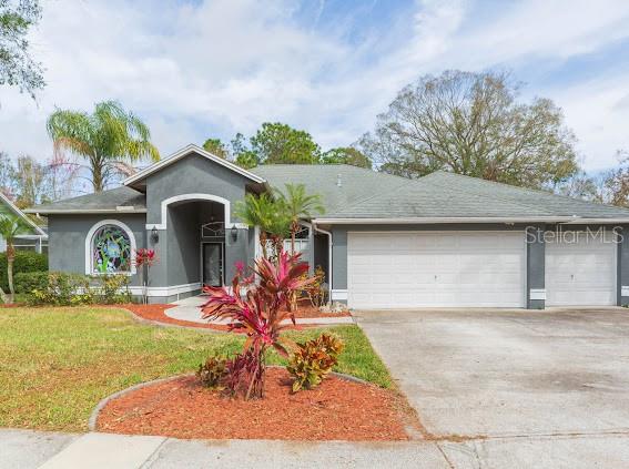 BACK ON THE MARKET with a BRAND NEW ROOF INSTALLED! Nestled in highly desirable Woodridge subdivision, this stunning pool home offers an unbeatable combination of luxury and convenience, with a low HOA of just $200 annually and NO CDD fees. Upon entering through elegant French doors with decorative glass, you're greeted by an open, inviting floor plan. To the left, the spacious master suite features sliding glass doors leading to the pool, a beautifully appointed ensuite with dual sinks, a garden tub, two walk-in closets, and a private toilet closet. The newly renovated kitchen is a true highlight, boasting sleek quartz countertops, stainless steel appliances, and wood cabinetry that offers both modern style and ample storage. The kitchen seamlessly flows into the living room, where a cozy wood-burning fireplace, surrounded by custom built-ins, sets the perfect atmosphere for both entertaining and relaxing. The rear bedroom has it's own private ensuite and access to the recently resurfaced pool and spa (2024)-ideal for enjoying Florida's year-round sunshine. Additional features include a new AC unit (2022) and stylish vinyl plank flooring throughout all four bedrooms. Located in one of Lutz's best kept secrets, this home is ideally situated just minutes from Highway 54,I-75,and a variety of shopping, dining, and entertainment options. You're only about 10 minutes away from the new Costco, Tampa Premium Outlets, and a brand-new Publix shopping plaza. The University of South Florida and Advent Health Center Ice are also nearby. With all these incredible amenities, this home is a MUST SEE!