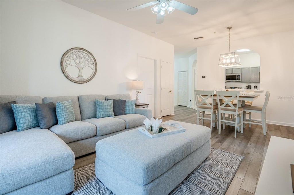 Photo of 2303 Butterfly Palm Way #303, Kissimmee, FL 34747 (MLS # O6419689)