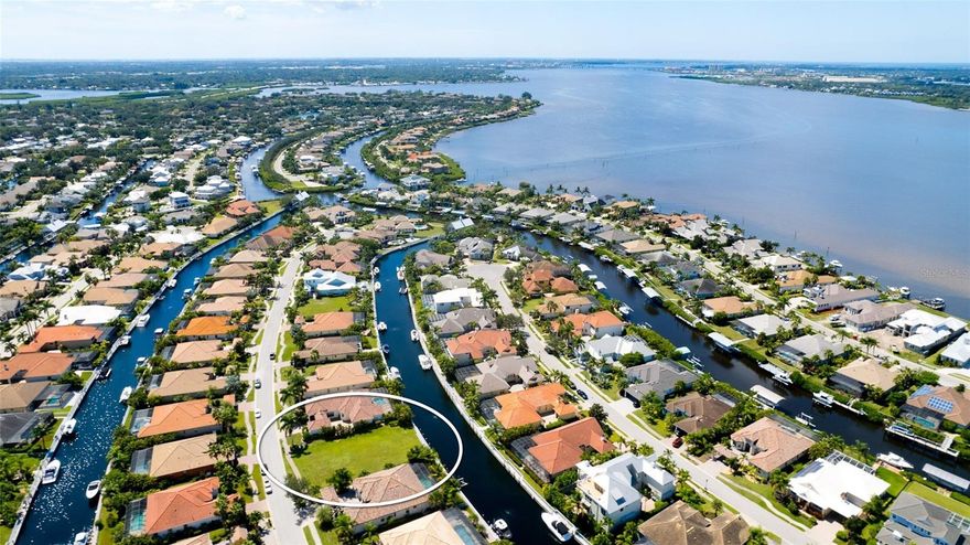 This is the LAST privately owned Stunning Waterfront Dream Lot in Exclusive Harbour Walk! Future Waterfront Residence offering over 78+ feet of canal frontage.  Owner may choose ANY builder! Find Camlin Homes on the 2nd photo to reveal a choice for the custom home builder who originally developed Harbour Walk. Take a look at this 3/2 home plan with 2,538 s.f. of Living Area, Auto Court with pavers, a three car garage, an outdoor living area and an area reserved for a pool. Camlin Homes has up to 25 other floor plans available for this lot. With proper notice, Boat Tours are available for serious/qualified buyers. Picture this one of a kind lot: An exclusive, waterfront paradise nestled within the heart of the illustrious Harbour Walk in Bradenton. For those elite enthusiasts who've envisioned creating their waterfront sanctuary, this privately owned luxury lot is the canvas upon which to paint your architectural masterpiece with any builder of your choice. Let's dive into the specifics: • Architectural Mastery: Think grandeur with a touch of traditional charm. Your home can boast a chic Port-o-Cochere and a hidden garage located at the back, ensuring the elegance of the streetscape remains uninterrupted. Rise and shine with options for approximately a 2500 minimum square feet 2 or 3-story layout, all within the accommodating guidelines of Bradenton. • Distinctive Exteriors: You have the luxury of choice with siding options ranging from the sturdy Hardy Plank to the rich texture of stucco. And, let's elevate that with a chic tile, metal roof, or slate roof – forget shingles, you deserve the best. • Lavish Amenities: • The dreamy fresh water canal, offers deep-water access leading straight from the Manatee River to Tampa Bay and the Gulf of Mexico. Imagine the lifestyle by boat to Bradenton, Anna Marie Island, Bradenton Beach, Longboat Key, Egmont Key (30 min) or catch a hockey game in Tampa! • From the private dock in your backyard to accommodate up to a 45 ft. vessel, note swift boat transitions with the Harbour Walk freshwater lift into the Manatee River, boasting a whopping capacity of ~25,000 pounds, 15 ft. beam, 25 ft. height. • Stroll along mesmerizing paver brick sidewalks or hop onto the community boat ramp. • Natural gas provisions, inviting front porches, and the assurance of privacy with gated exclusivity. • Connectivity & Conveniences: Whether by land or sea, reach Tampa Bay in a 6-mile boat ride, or the Gulf of Mexico in 12 miles. You're never too far from urban comforts with the Bradenton and Sarasota Airports about 15 minutes away and a short jaunt to downtown St. Pete. • Educational Excellence: Quality education is paramount, and you’re surrounded by highly-rated public schools and state-of-the-art private institutions that promise a bright future. • Recreational Delights: • Get hooked with fishing and boat maintenance clinics. • Enjoy the camaraderie of the Cruise Club with regular outings. • Tennis, canoeing, kayaking, and a dedicated playground – there's never a dull moment. • Connect with nature on estuary walks or indulge in private saltwater fishing on community docks. To the discerning buyer with an appetite for opulence and a passion for the waterfront lifestyle, this is your golden ticket. Imagine your custom-built sanctuary in this dreamy enclave, surrounded by the best of nature and luxury. This is the start of your Harbour Walk legacy! Utilities are ready to connect. Survey Available.