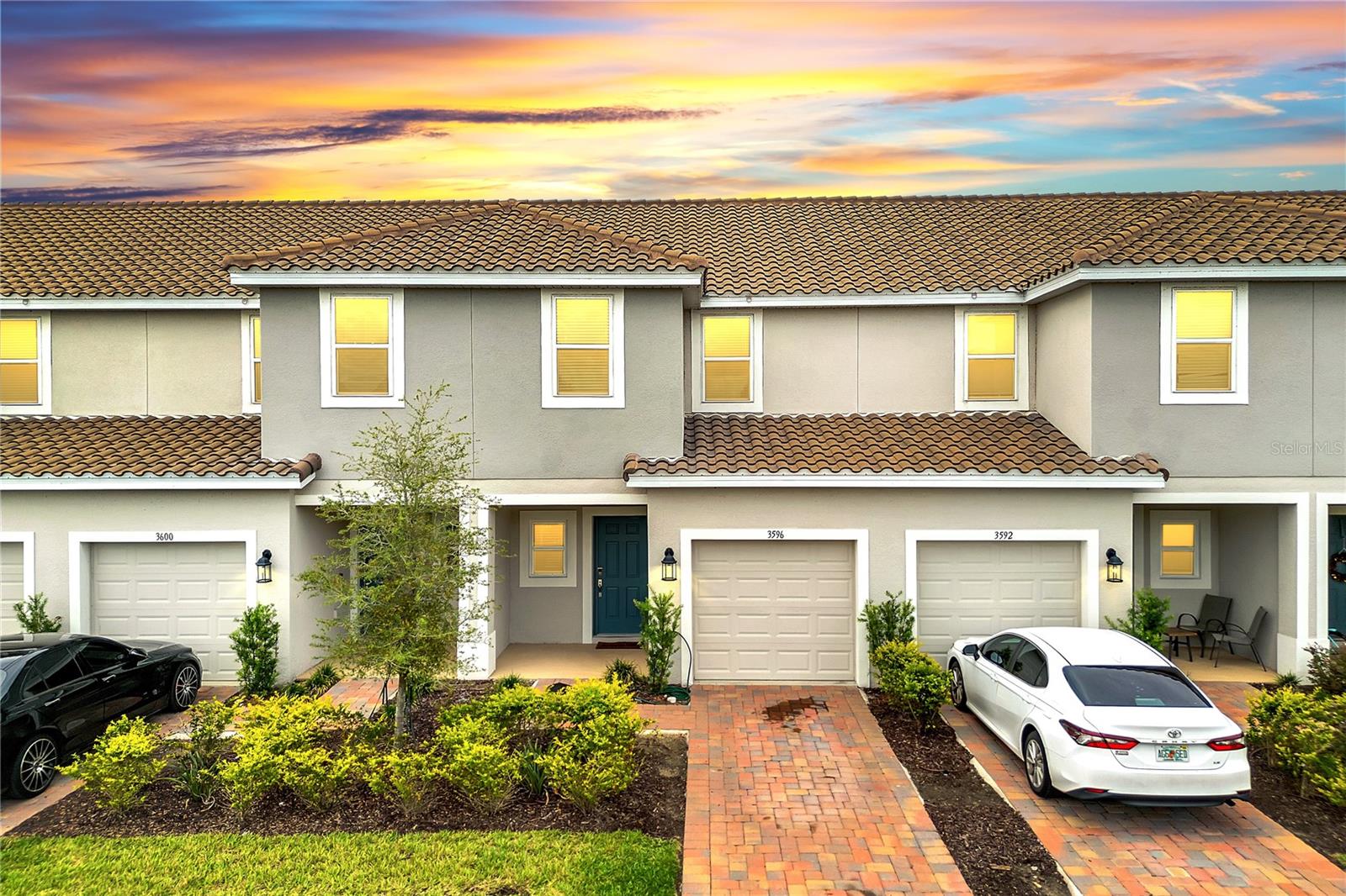 Welcome to Bellalago! This nearly new townhome, completed in December 2023, sits on a premium pond-view lot and offers modern finishes, a practical layout, and access to one of Central Florida’s most desirable resort-style communities. Built with a durable concrete tile roof, this home is designed to last. Inside, the great room plan seamlessly connects the living and dining areas to an open kitchen with a large island, perfect for entertaining and everyday living. The first level also features a convenient half bath, a one-car garage, and a large outdoor patio with fenced sides for privacy overlooking the pond. Upstairs, you’ll find two secondary bedrooms with a shared full bath, plus a spacious owner’s suite with its own en-suite bathroom. The laundry area is located upstairs for added convenience. Storage is abundant with under-stair storage, a large pantry, linen closet, and three bedroom closets. Residents of Bellalago enjoy unmatched amenities, including a resort-style pool, fitness center, playground, basketball and tennis courts, and even a private community boat ramp and dock with direct access to Lake Tohopekaliga. Families will also love being zoned for Bellalago Academy Charter School (K–8), located right within the community. Perfectly located near shopping, dining, and major highways, this home combines comfort, convenience, and an unbeatable community lifestyle. Don’t miss the chance to own in Bellalago—schedule your showing today!