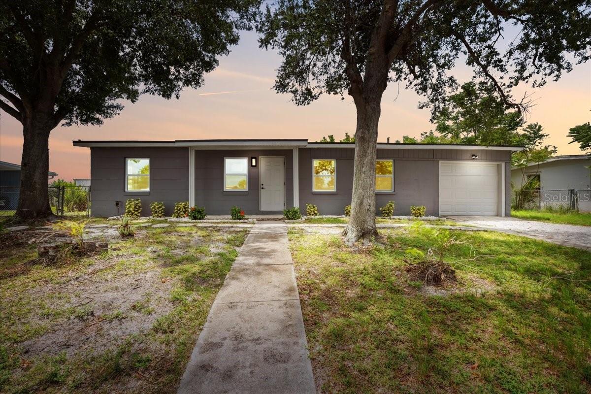 **FREE HOME WARRANTY TO BUYER**This beautifully FULLY REMODELED 3 BEDROOM, 2 BATHROOM home located in PORT CHARLOTTE is completely move-in ready and qualifies for FHA AND VA FINANCING. The home will easily PASS A 4-POINT INSPECTION and comes with a WIND MITIGATION REPORT, offering potential DISCOUNTS ON INSURANCE thanks to all the major updates already completed. Recent renovations include a NEW ROOF (2025), NEW ELECTRICAL PANEL (2025), and NEW WATER HEATER (2025). The interior has been thoughtfully redesigned, featuring a SPACIOUS MASTER BEDROOM SUITE with a WALK-IN CLOSET, DUAL SINKS, and a BRAND NEW MASTER BATHROOM WITH DUAL SINKS. An ADDITIONAL SITTING ROOM off the master can be used as a HOME OFFICE, DRESSING ROOM, SHOE COLLECTION SPACE, or SECOND CLOSET—you decide! A STYLISH BARN DOOR adds a custom touch. The entire home has been FRESHLY PAINTED and features LUXURY VINYL PLANK FLOORING THROUGHOUT – NO CARPET. You'll appreciate the INSIDE LAUNDRY ROOM, ONE-CAR GARAGE, and a HUGE BACKYARD with a PATIO AREA, perfect for entertaining or relaxing in your own private space. The KITCHEN HAS BEEN FULLY REMODELED with QUARTZ COUNTERTOPS, BRAND-NEW STAINLESS-STEEL APPLIANCES, including a DISHWASHER and GARBAGE DISPOSAL. Additional updates include ALL NEW LIGHT FIXTURES, DOORS, TRIM, and more. With NO HOA, there's PLENTY OF ROOM TO STORE YOUR BOAT, GOLF CART, OR TOYS without any restrictions. Conveniently located near schools, parks, shopping, dining, and just a short drive to BEAUTIFUL GULF COAST BEACHES, this TURNKEY PROPERTY offers modern living with peace of mind. Don’t miss your chance to own this incredible home in one of Southwest Florida’s fastest-growing communities! SEE FLOOR PLAN, FEATURE SHEET AND INSURNACE QUOTE ATACHED IN MLS