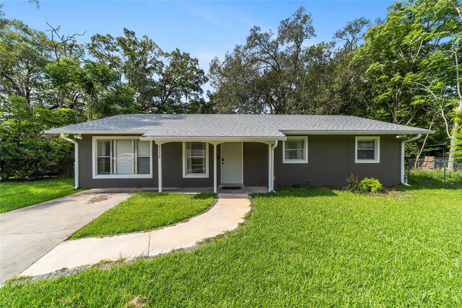 Charming and cute MOVE-IN READY 3/2 home in Ocala Highlands! This adorable home has been recently updated - ROOF 2025, HVAC 2018, Luxury Vinyl Plank and carpet (in bedrooms) 2024, Exterior paint 2025, Bathroom vanities 2024, Epoxy flooring on back porch 2024, Primary shower 2023, Kitchen island 2021, and interior paint 2021. Enjoy cool evenings this fall on the 12x25 screened porch! No HOA. 10'x12' shed. Washer and dryer included. Ring doorbell included. Gorgeous mature oak tree in the fenced back yard. Great location, too - convenient to schools, shopping and dining! (POOL NOT INCLUDED)