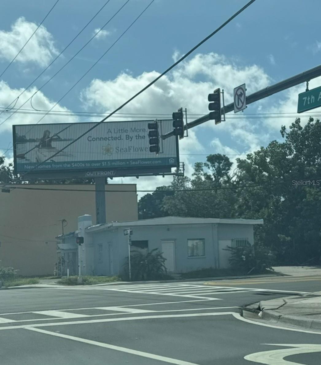 Bradenton Corner-Lot Commercial Property with Guaranteed Passive Income & High Upside — Situated on a highly visible corner near downtown Bradenton, this prime commercial property features a 10-year billboard lease generating a guaranteed minimum of $15,000 annually, with annual fee increases beginning in year 5. The billboard is fully maintained by a third party, delivering truly passive, hassle-free income from day one. The 1,922 sq ft concrete building sits on an 8,350 sq ft lot and offers a blank canvas for full renovation or redevelopment to maximize its high-traffic location. With immediate cash flow this property combines stability with significant value-add potential — a rare opportunity to secure both predictable returns and long-term growth.