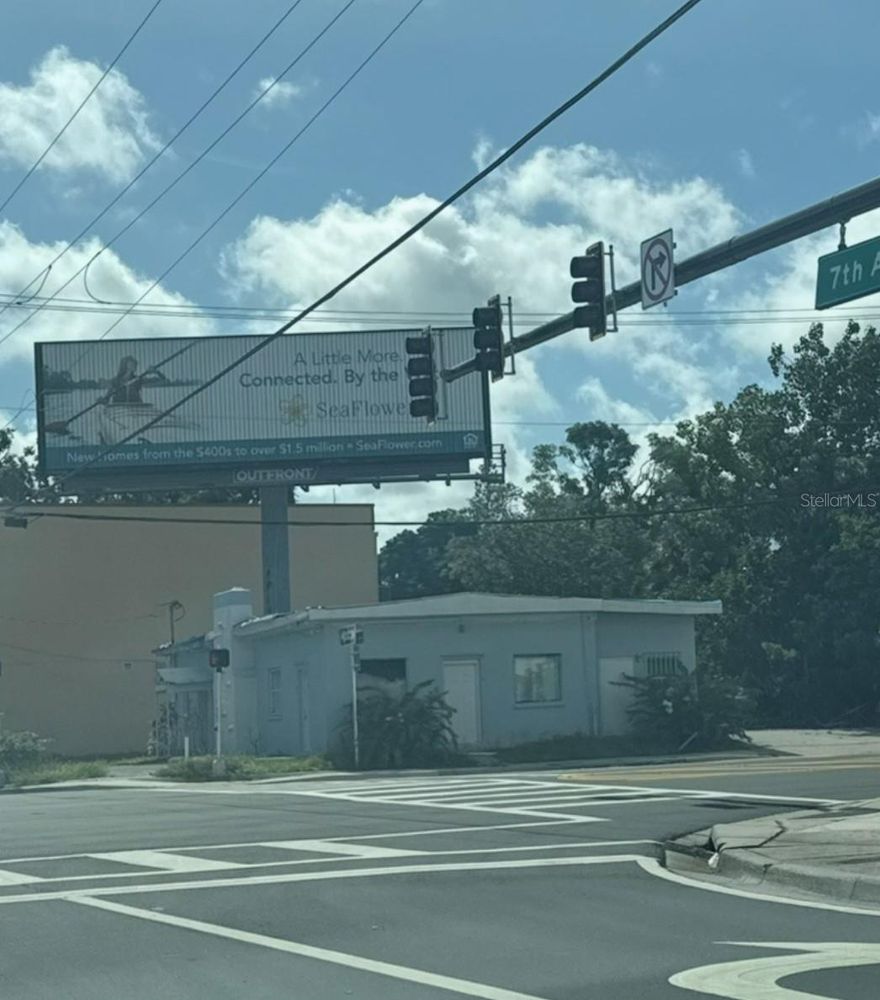 Bradenton Corner-Lot Commercial Property with Guaranteed Passive Income & High Upside — Situated on a highly visible corner near downtown Bradenton, this prime commercial property features a 10-year billboard lease generating a guaranteed minimum of $15,000 annually, with annual fee increases beginning in year 5. The billboard is fully maintained by a third party, delivering truly passive, hassle-free income from day one. The 1,922 sq ft concrete building sits on an 8,350 sq ft lot and offers a blank canvas for full renovation or redevelopment to maximize its high-traffic location. With immediate cash flow this property combines stability with significant value-add potential — a rare opportunity to secure both predictable returns and long-term growth.
