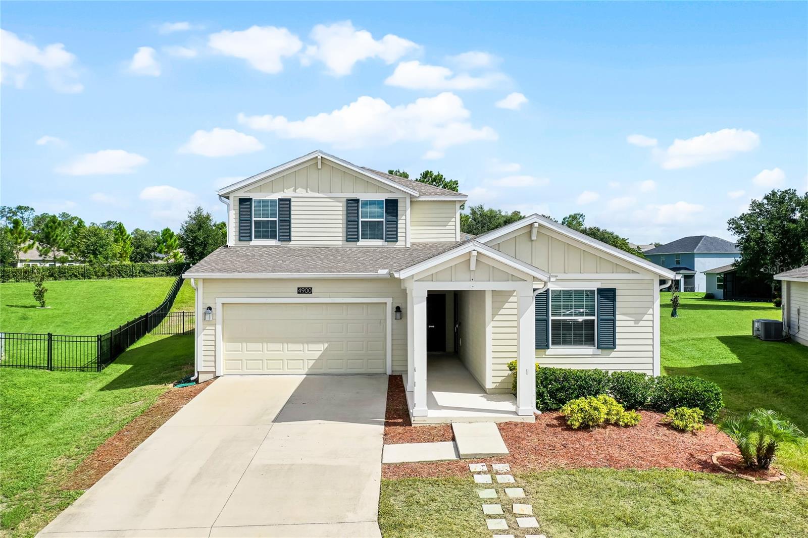 Motivated Seller!! You are invited to view this beautiful NEX GEN HOME with MOTHER IN LAW SUITE that is priced well below market value. The home has 5 bedrooms, 4 bathrooms and is located in the very desirable gated community of Stoneybrook Hills, Mount Dora. This unique property offers a next-gen home concept, designed for the ultimate multi-generational lifestyle. The in-law sweet has a private entrance, kitchen, laundry, bathroom, and bedroom. The interior of the main home features a spacious layout and an open floor plan which includes a dedicated office space with barn doors, energy-efficient appliances, double pain vinyl windows and solar panels. The chef’s kitchen is equipped with quartz countertops, solid wood cabinets, stainless steel appliances and an oversized island that seamlessly connects to the living room. The beautiful tile floors really compliment the homes style and expansiveness. The primary bedroom is located on the first floor and is adorned with luxury vinyl flooring. The primary bath and walk in closet are worthy of a spa like experience. All remaining bedrooms and bonus room upgraded with luxury vinyl floors. The oversize backyard is fully fenced, providing privacy and security, perfect for outdoor relaxation and entertainment. The community has first class amenities which include a fitness center, resort-style swimming pool, playground, tennis courts, basketball courts, baseball field and gate attendants staffed 24-hours. The community is just minutes away from downtown Mount Dora and public access to the chain of lakes, as well as US 441 and the 429, easy access to all that Orlando has to offer. ******This home comes with solar-panels and the buyer will need to take over this lease at purchase. The monthly lease amount is $85. The new owner will enjoy the benefits of lower energy costs!