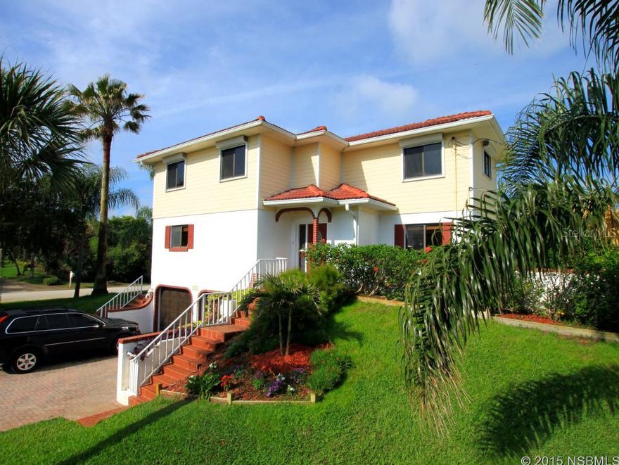OCEAN VIEWS can be seen from this gorgeous 3 bedroom/2.5 bath Mediterranean style beachside home on corner lot with tiled roof located on a high dune. Just a stoneâs throw to the beach access of the beautiful no drive sugar sand beach of Ponce Inlet. Light & bright and tastefully decorated with tropical colors & beautiful Armstrong wood laminate flooring throughout living area. French doors lead from the spacious great room to the inviting outside patio built to capture the ocean breezes. The large chefâs kitchen has ocean views and is fully equipped with all appliances, custom cabinetry with some decorative cabinets with glass doors, Corian countertops & a large breakfast bar. Updated bathrooms all have ceramic tile floors.    Master suite has bath with large tiled shower, bidet & bead board wainscoting add extra dimension to the room. Guest bedrooms are spacious & one has nice ocean views and a peak of the Ponce DeLeon Lighthouse. Newer upgraded HVAC system, new hot water heater & garage opener. Stately palm trees, manicured landscaping, flower beds & an aromatic hedge of Jasmine creates the perfect atmosphere and curb appeal. Hurricane shutters on all windows & doors & security system for added peace-of-mind. The brick paver driveway is flanked by two decorative columns with lights & the front entryway has a stylish mosaic tile stairway. The oversized garage with double wood doors allows room for both cars & toys. Great house with beachy feel including the pelican mailbox! Walk or bike to local waterfront restaurants, Ponce Inlet Lighthouse & Jetty Park, Marine Science Center, marinas & more! This is a must see! ;Water: City