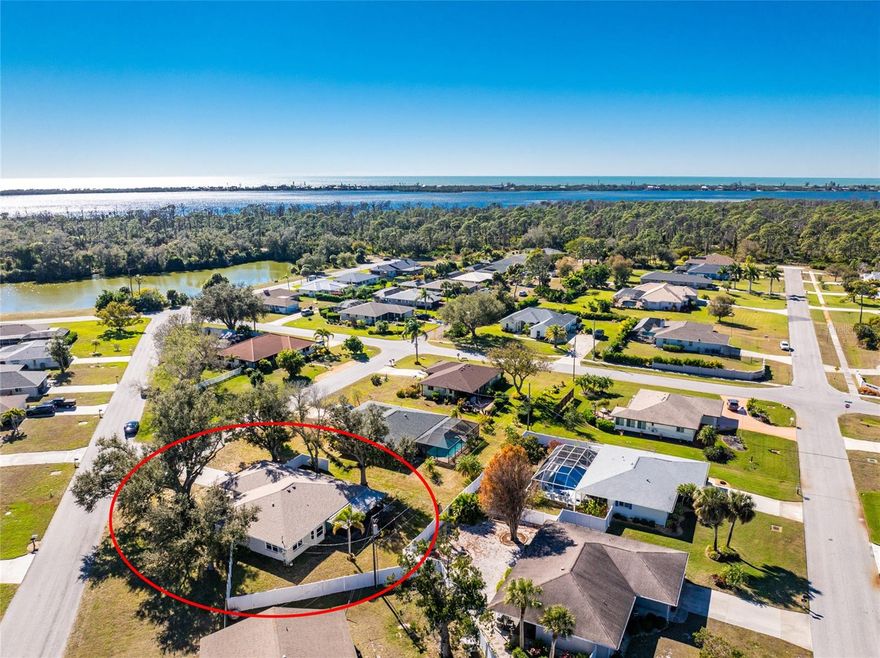 Tucked beneath a canopy of majestic oaks, this Bay Vista home offers comfort, privacy, and quick access to all that Lemon Bay Park has to offer. This beautiful three bedroom, two bathroom home is located in the X flood zone and also features a Florida room and a bonus room, providing plenty of flexible living space. A screened entry welcomes you inside, where easy maintenance tile flooring runs throughout the home. The great room, kitchen, and dining area flow together in an open layout, creating a bright and comfortable space for everyday living and entertaining. The kitchen features wood cabinetry with crown molding and abundant pull out drawers, granite countertops, a glass tile backsplash, and a charming breakfast nook with a bay window overlooking the backyard. Just off the main living area, the spacious Florida room offers sliding glass doors leading to the screened lanai, along with additional sliding doors opening to a bonus room that works perfectly as a home office, gym, or hobby space. The light and bright primary suite includes a walk-in closet, while the ensuite bathroom features a fully tiled step in shower and granite topped vanity. Both guest bedrooms are generously sized with reach-in closets, and the guest bathroom has been beautifully remodeled with European style frameless glass shower doors, a large fully tiled walk-in shower, and a granite topped vanity. The large backyard is partially privacy fenced, creating a peaceful sense of seclusion. Additional updates include a 2024 roof, 2025 hurricane rated windows installed throughout most of the home, a 2025 air conditioning system, and a 2018 electric panel replacement. For those who love spending time outdoors, this home places you close to everything, including less than six miles to Englewood Beach and Manasota Key Beach and approximately two miles to Historic Dearborn Street, where you can enjoy dining, shopping, farmers markets, and year round community events. Bay Vista offers the best of both worlds: an optional HOA paired with reasonable deed restrictions that help maintain the neighborhood’s attractive, well-kept feel. Nearby Lemon Bay Park offers 210 acres of natural beauty with 1.7 miles of shoreline along the Lemon Bay Aquatic Preserve, nature trails, a butterfly garden, and educational programs throughout the year. The location also provides convenient access to beaches, shopping, medical facilities, local restaurants, Venice Island, and Wellen Park. This home at 1030 Gasparilla Blvd truly offers everything needed to enjoy the laid back Florida lifestyle.