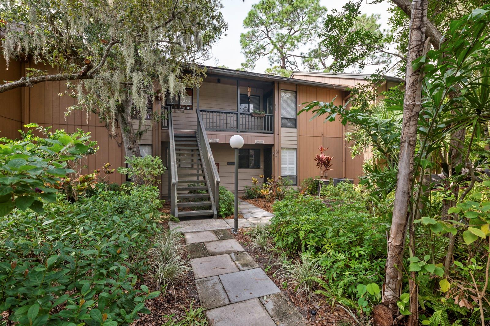 Its easy to enjoy the beauty of coastal waterfront living in Pelican Cove and this 2 bedroom/2 bath condo. The kitchen has been enhanced with solid wood cabinets, recycled quartz counters and a breakfast bar that opens onto spacious dining and living room flowing onto glassed/screened lanai overlooking private preserve views. The split floor plan includes a master bedroom with updated bathroom, walk-in closet and upstairs attic space for additional storage. Pelican Cove community is found amid 75 acres of lush, landscaped grounds with miles of scenic walking trails and paths, four lighted tennis courts, three clubhouses, an 87-boat slip marina, and its own "Pelican Cove University" offering a wide range of courses and many recreational clubs. Special events are featured monthly in the Pelican Cove Newsletter. Owners also enjoy the complex's bird sanctuary, botanical gardens, fishing pier, saltwater creek and spectacular coastal views from many locations within the complex.