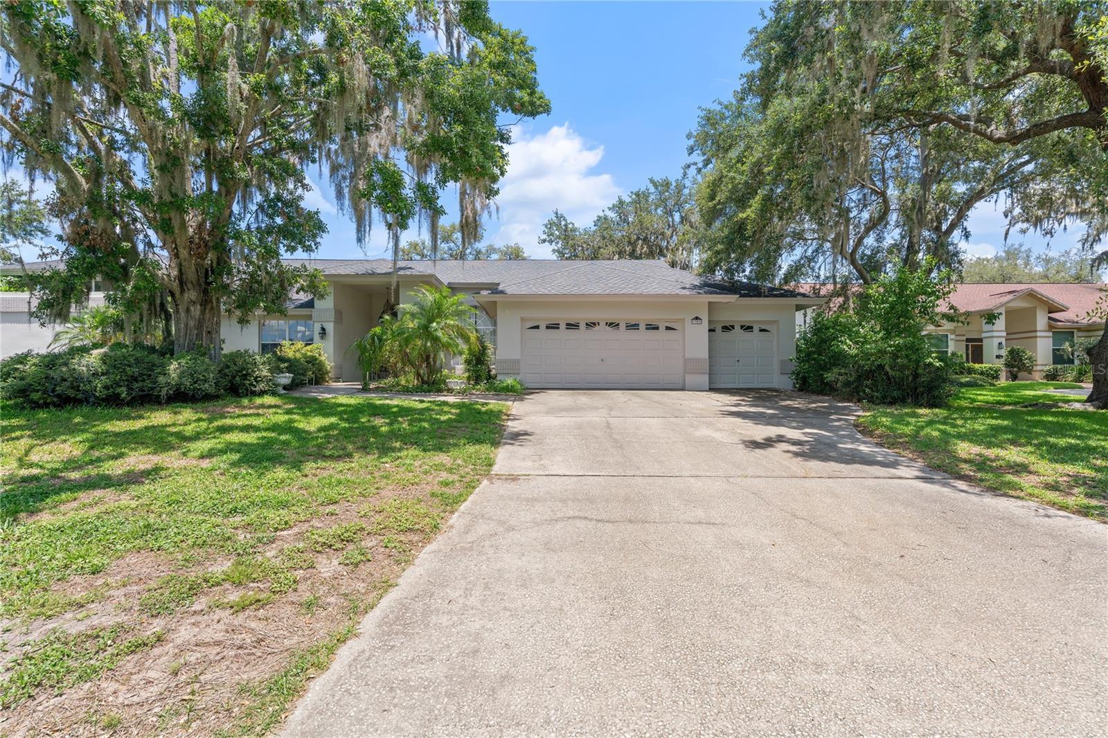 Experience the best of executive living in this beautifully maintained Walden Lake Community, located in the sought-after Tanglewood community. This spacious residence needs a little tlc in the primary suite and features 4 bedrooms plus a versatile office or 5th bedroom, 3 full bathrooms, a sparkling pool and spa, and a 3-car garage.
Step inside and you are greeted with classic leaded glass double doors to discover soaring ceilings, custom door trim, and striking interior leaded glass transoms. The flexible floor plan offers formal living and dining rooms, a 3-way split bedroom layout, and a private guest suite with its own bath and convenient pocket door. The primary suite includes French doors to the lanai, laminate flooring, a generous walk-in closet, a jetted tub, large shower, dressing vanity that needs to be repaired, and a separate water closet.
The dedicated office or 5th bedroom is finished with laminate flooring, wainscoting, a built-in desk with cabinetry, and a walk-in closet. The remaining bedrooms are generously sized at 12x11 and 12x12. The heart of the home is the open kitchen and family room, featuring granite countertops, stainless appliances, a skylight, tile backsplash, wall oven, counter seating, and a spacious breakfast nook overlooking the pool. The family room centers around a cozy brick wood-burning fireplace and large sliders that open to the expansive lanai.
Enjoy Florida living at its finest with a 15x30, 7-foot-deep resurfaced pool less than 5 years ago, spa, and a party-sized lanai offering covered seating on both sides. The outdoor kitchen is equipped with a Jenn Air range, bar sink, and cabinetry—perfect for entertaining. Additional highlights include a 6x6 walk-in pantry with recessed fridge, an oversized laundry room with built-ins, and a discreet storage shed for lawn equipment. Recent updates include a new roof (2024) and fresh exterior paint.
Walden Lake offers miles of walking and biking trails, a lakefront park with playground, butterfly garden, fishing pier, sports complex, dog park, and more. Discover the charm of Historic Plant City and enjoy easy access to all the amenities this vibrant community has to offer. Schedule your private tour today!