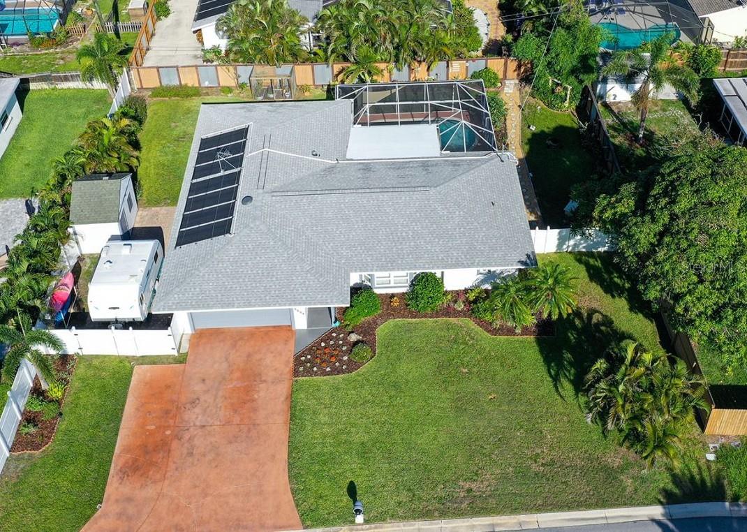 Your coastal retreat awaits in this beautifully updated, well-maintained, three bed, two bath pool home in desirable
Phillippi Gardens. Nestled on a quiet and spacious lot, close to beaches, Gulf Gate shopping, and the vibrancy of downtown Sarasota. World famous Siesta Key Beach, with it's sugar sands and azure waters, is just minutes away! Enjoy gentle Gulf breezes and pastel sunsets in your private back yard oasis, complete with a covered and screened lanai, solar-heated pool, and lighted tropical gardens. An extended two-car garage and fenced back yard, complete with paver pad and storage shed, provide ample storage options. NO HOA or CDD...Bring your RV, boat, or vacation rental dreams! A new strapped roof (Miami/Dade approved) in 2023 and new HVAC in 2025 protect your investment for years to come. Inside, you'll find a split floor plan with updates in every room, including a kitchen featuring a gas stove, pantry, and custom 14" cabinets with granite counters and backsplash. The primary bedroom offers direct access to the lanai and a renovated bathroom. The third bedroom doubles as an office with two built-in desks and cabinets, ideal for remote work. Feel safe at home protected by an EMG/Alert 360 security system, a fresh water 170-foot deep well, reinforced Miami/Dade rated garage door, and a generator port to power the entire house during outages. Public sewer connected in 2019 and new electric service (with a 200-amp panel) in 2022. Recently painted inside and out. This wonderful home is NOT in a flood zone and had NO water intrusion during the 2024 storm season. Embrace the coastal lifestyle or capitalize on the great vacation rental market with this MOVE IN READY home. Schedule a tour today!