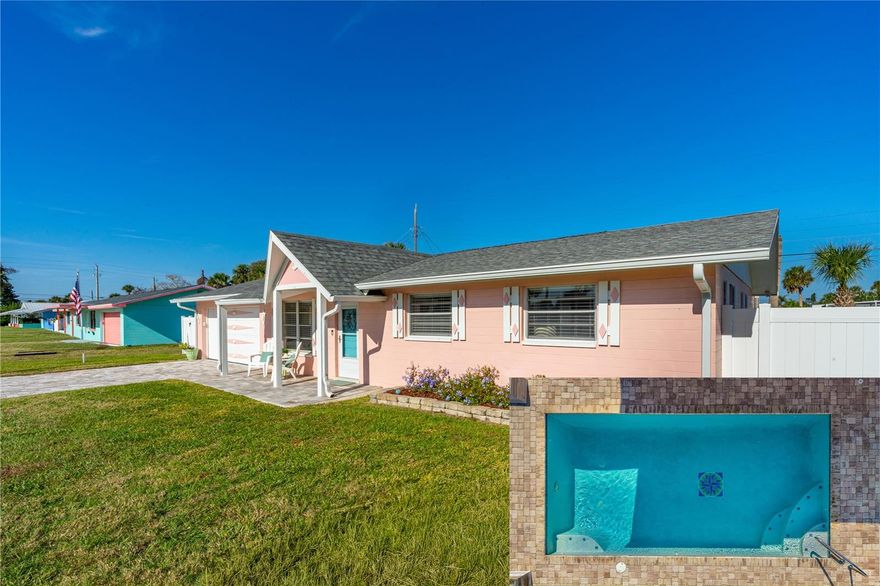 Stunningly updated beachside home, perched high and dry in one of the South Peninsula's most sought-after neighborhoods! This turnkey, furnished 3BR/2BA will absolutely steal your heart. It features a 2018 roof, newer impact windows (all but 3), newer AC, newer water heater, updated electrical panel, and an oversized extra-long 2-car garage. There is room for your cars AND your toys in this garage! The kitchen offers soft-close cabinetry and granite countertops, and both bathrooms blend modern updates with restored vintage charm. Ensuite primary bedroom, step in shower. 2020 saltwater heated pool, a fully fenced backyard with double gates and room for a boat or RV, plus a beautifully painted outdoor shower. Alarms on all windows and doors leading to the pool. Walk to the beach, and only ½ mile to Publix and the public recreation area with golf, tennis, pickleball, and playgrounds. Zoned for top-rated schools. Perfect as a primary home, beachside retreat, or investment property