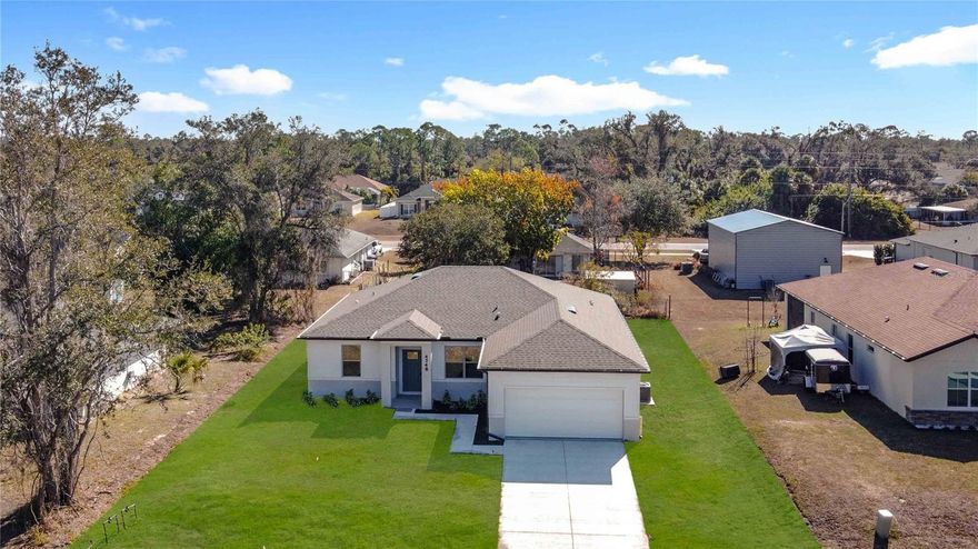 Here is the home you have been searching for!  A new construction home with CITY WATER  in North Port and no HOA! This affordable new home is ready now!  The Acosta floor plan has a great layout with an open and versatile floor plan. Great location with easy access to shopping, schools, parks, medical and shopping just east of Toledo Blade Blvd. and South of E. Price Blvd. The home features 4 bedrooms, 2 full bathrooms, a formal dining room, a living room, an open kitchen, and a 2-car garage with 1,810 square feet of living space. The living space is well utilized, with ample room for large households. The high ceilings and interior features will give you the quality and luxury you were looking for in your new home. This home has a split layout with the primary suite on one end and the guest bedrooms on the other. The Primary bedroom has a tray ceiling and large windows that bring in natural light, plus a resort-style primary bathroom with a walk in shower, double vanity, and a large walk-in closet. The living room also receives plenty of natural light and has access to the covered lanai. The great room is open to the kitchen, where you’ll find a large center island for casual meals. The kitchen features stainless steel appliances, Shaker-style cabinets with crown molding, and granite countertops. The dining room is at the front of the home, with a nice size window providing even more natural light. The home includes luxury vinyl flooring throughout for durability and comfort. You’ll love these floors—easy to maintain and a trending design element in new homes. Other features include Shaker-style cabinets with hardware and granite countertops in the bathroom, tiled walls in the owner’s shower, and a tiled shower floor, a garage door opener, R38 insulation, 16 SEER AC unit and more. Take advantage of the seller’s warranty when purchasing this home. Check out any of our other homes under construction. We have a variety of locations and color schemes for you to choose from.