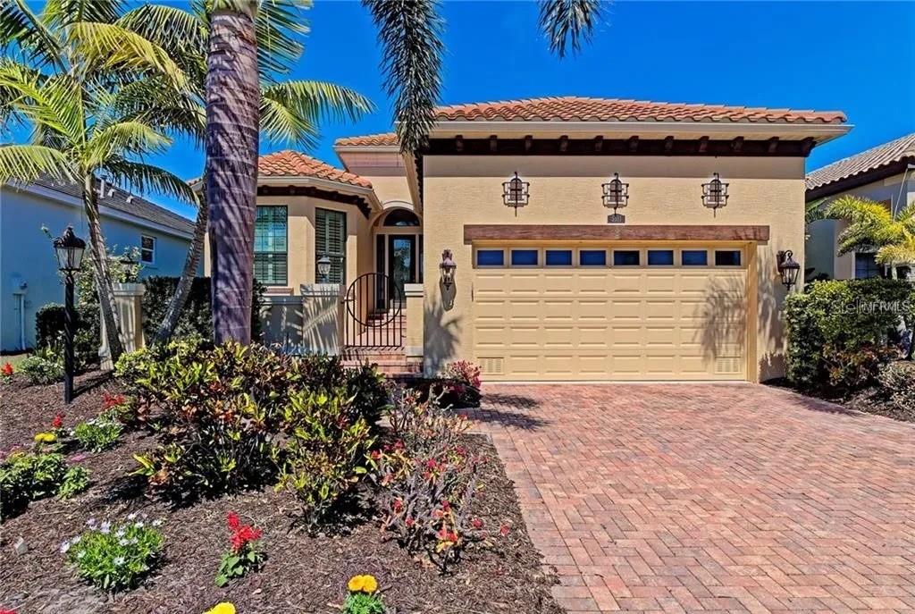 LOCATION AND LUXURY ! This John Neal Signature Home shows like a model ! Conveniently located in the beautifully landscaped and well desired gated maintenance free community, Legends Bay. The home boasts a great den, Gourmet kitchen, open floor plan and a lovely outdoor grilling area by the pool. The exterior welcomes you with an entry courtyard, barrel tile roof and brick paved driveway. The kitchen also has a breakfast bar and room for entertaining all your friends. Larger sliding glass doors open up to your private patio oasis and pool. Many upgrades through out this custom Signature home including crown molding, tray ceilings, Conveniently located by the world famous IMG