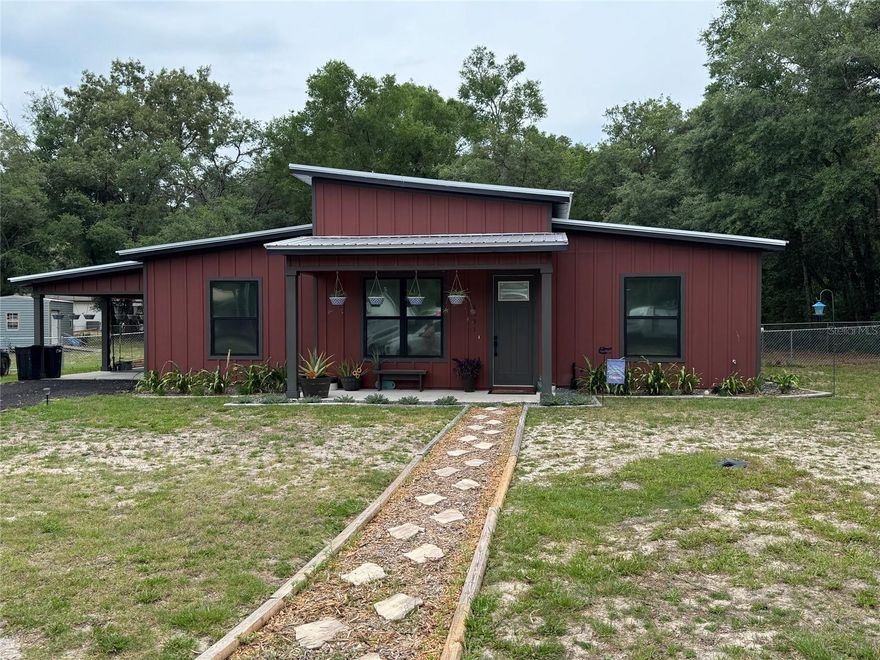Imagine your own little oasis of country living with all the amenities of brand new.  VERY open floor plan with open kitchen with wood cabinets and quartz counter tops that overlooks the dining room as part of the great room.  High ceilings through out.  Primary bedroom with tray ceiling.  Primary bath has double sinks and a walk in shower.  Second and third bedrooms with ultra deep closets (one even made into a computer station).  Inside laundry utility room.  Large fenced private back yard with Florida Peach Trees that is perfect for kids and pets to play includes a good sized 12 X 24 storage shed.  This is a must see only minutes from Gainesville, Trenton, and Chiefland.