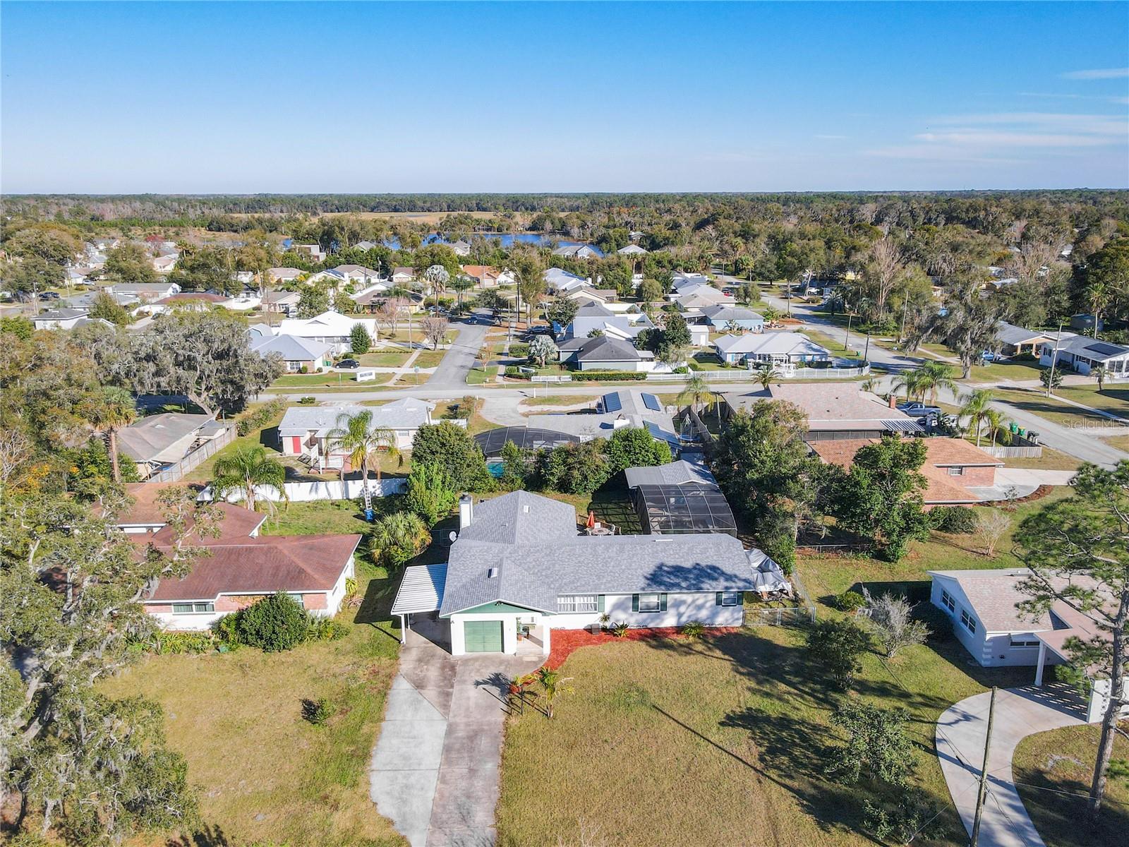 Discover the epitome of comfortable living in this charming DeLand Pool House! This 3-bedroom, 2-bath home features luxury wood floors throughout, creating a warm and inviting atmosphere. The stylish kitchen features brand new stainless steel appliances, including a refrigerator, oven, and microwave. Immerse yourself in the spaciousness of this well-maintained home, where a brand new roof, wood porch deck, and fenced yard add to the allure. Dive into relaxation in the saltwater swimming pool, installed in 2020, surrounded by a screened enclosure that provides the perfect private oasis. Additional storage is conveniently located in the on-site building. Nestled in a serene neighborhood with no HOA, this residence offers peace and tranquility while being near DeLand High School, Stetson University, downtown, restaurants, shopping, and medical facilities. Enjoy the convenience of a new roof and carport (2020) along with the reassurance of a recently replaced AC unit (2019). Indulge in the ideal blend of comfort and convenience – seize the opportunity to make this house your home today. All information provided is believed to be accurate, but we recommend verification by the tenant's agent for complete peace of mind." The owner is willing to leave the lawn mower and weed eater for the tenant to cut the grass.