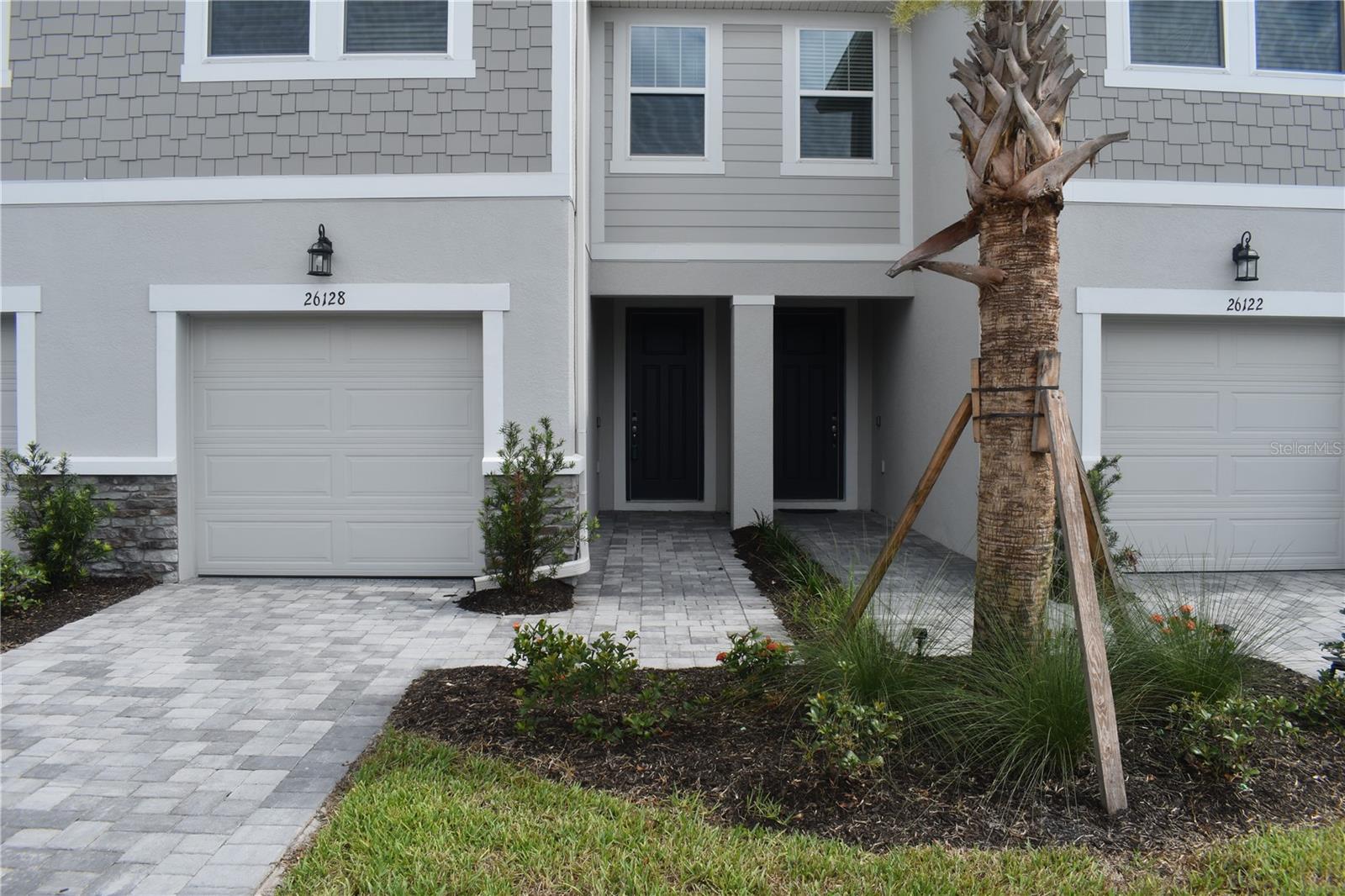 Great townhome in the private gated community of Volanti to be clean, fresh, and move in ready. The first floor living area is a kitchen/family room combo that overlooks beautiful woods and water scenery. The spacious eat-in kitchen features beautiful quartz countertops, an abundance of tall cabinets, and all new stainless-steel appliances. The large center island layout makes this home ideal for entertaining guests. Ground floor flooring is a nice wood-look tile that flows throughout all lower-level rooms. The home includes a screened and brick paved lanai with a beautiful view of the scenic pond, nature, and occasional wildlife. Always a wonderful place for coffee or relaxation, with no neighbors behind you. The second floor includes all three bedrooms and a loft that is perfect for flex space, movies, or just to hang out. The Primary bedroom offers a large double vanity, a spacious walk-in shower, and as an added bonus, a beautiful view of the pond through the double windows and plenty of sunshine in the mornings. Enjoy the large and beautiful heated community pool all year long. Also, a BBQ area, outdoor fire pit, a dog park and walking trail around the main pond. This beautiful community is located a short distance from I-75, and is convenient to Tampa Premium Outlet Mall, the Shoppes at Wiregrass, the Wesley Chapel Groves, sports parks, and more. School districts are Veterans Elementary, Cypress Creek Middle School and Cypress Creek High School. Includes all appliances. Application fees $125.00 per adult.
