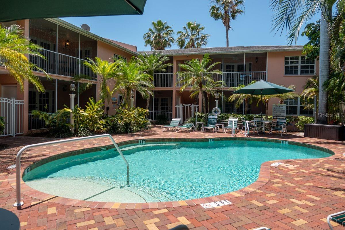 Emersed in a lush oasis-like setting, Siesta Key Inn is an enchanting experience of luxurious leisure with an island resort ambiance. The dream vacation lifestyle is a reality with full-service amenities complemented by tranquil tropical views afforded nearly every residence while being mere seconds away from the soft powdery sands of Siesta Beach. Comprised of eight one- and two-bedroom units, impeccable improvements and design aesthetics throughout meet even the highest standards. Each residence includes a full kitchen, quality finishes of Quartzite countertops, soft-close wood cabinetry, Moen and Kohler fixtures, Jacuzzi jetted tubs, upscale crown molding and LED lighting, and an inside washer and dryer to establish a true sense of home. Feel rest assured that Siesta Key Inn has been built to exceed expectation for security and comfort with prestressed concrete walls and floors with whisper mat rubber membranes between the floors, Pex plumbing, multiple tankless water heaters with natural gas and multiple electric water heaters, open-cell foam insulation in the attic, Square D electric panels, Eco-flow water filtration systems, and hurricane impact windows and doors. The property has been thoughtfully designed for you to enjoy opportunities of serene indulgence where you can lounge by the expansive pool boasting therapy jets and waterfall features, a nearby grilling area, gazebo and bike rack. To make your beach adventures all the better, there are beach chairs, umbrellas, towels and coolers to use as well. Explore the sights and attractions of Siesta Village just beyond the beach and journey over the bridge to fall in love with downtown Sarasota.