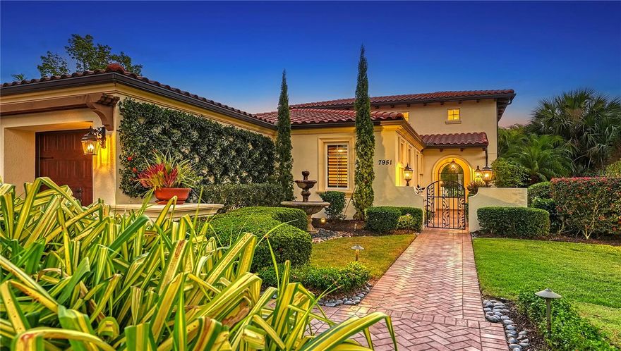 PRICE IMPROVEMENT! Welcome to a timeless masterpiece of old-world Tuscan elegance in the maintenance free (lawn and pool) part of The Lake Club. Every square inch of this exquisite custom London Bay home is crafted with exceptional materials: travertine stone and hardwood floors, high-end custom cabinetry, 18-foot soaring wood beamed ceilings, arched doorways, bedrooms with ensuite bathrooms, and custom closets. A decorative iron wrought gate leads you into the inviting courtyard past a beautiful fountain through the glass front door where sun rays shower the spacious living area. This home pampers the homeowner with exacting tastes and standards. The gourmet kitchen features solid wood cabinets with soft light colors, two pantries, an enormous center island with beautiful granite, built-in top of the line Thermador appliances, separate freezer and refrigerator, pot filler and gas cooking. The phenomenal floor plan allows for complete privacy of the owner's suite separate from the guest bedrooms. The owner's suite has private access to the outside pool area. This space is a private sanctuary with a beautifully appointed dressing room and luxurious bath. The other two bedrooms are ensuite, each with a full bathroom. The third bedroom boasts a custom Murphy bed and could easily double as an office. Disappearing hurricane impact glass doors open to invite outdoor living. The Italian inspired lanai with outdoor kitchen and fireplace reminds you that life should be enjoyed, and every day should be savored. Relax around your salt water heated pool and spa. Enjoy starry evenings around your gas firepit overlooking the tranquil lake. FGBC Certified, this home features high efficiency Icyeane insulation, whole water filtration and softening, reverse osmosis in the kitchen, high efficiency HVAC, tankless water heater, whole house audio with Control 4 and Sonos, and an EV charging station. The Lake Club is an amazing gated community boasting a Grande Clubhouse with dining, special events, resort style amenities including a pool, tennis and pickleball courts, fitness center, and interlinking lakes for kayaking and fishing. All of this in an area close to excellent public and private schools and near the Interstate for quick access to restaurants, entertainment, and world-class beaches. Walk its halls, then walk its grounds. I’m sure you’ll agree, this is a rare jewel amongst a community of upscale homes.