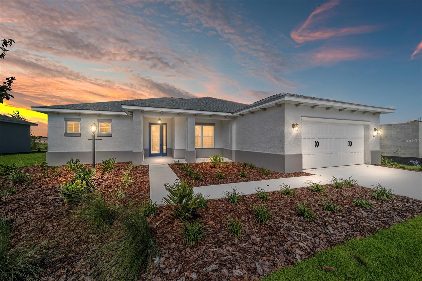 Welcome to the Livingston Model, a beautifully crafted new construction home located in LongLeaf Ridge at On Top of the World, Ocala’s premier 55+ active adult community. This thoughtfully designed home offers 2 bedrooms, 2 bathrooms, an oversized 2-car garage with golf cart parking, and a versatile open flex space perfect for a home office or hobby area. At the heart of the home, the gourmet kitchen features stainless steel appliances, premium white cabinetry with crown molding, quartz countertops, under-cabinet lighting, an elegant backsplash, a pantry, and a spacious island—ideal for both meal prep and entertaining. The dining area, highlighted by a chandelier and backyard views, flows seamlessly into the open living space. From the living area, a 3-panel sliding door opens to the screened lanai, creating a perfect indoor-outdoor lifestyle. The primary suite is a peaceful retreat with two windows overlooking the backyard, a walk-in closet, and a spa-like en suite complete with double vanity sinks, quartz counters, tiled flooring, and a zero-entry tiled shower with built-in bench. The guest bedroom is conveniently located near the full guest bathroom, which includes a single quartz vanity and a tiled tub/shower combination. With its elegant finishes, open design, and access to world-class amenities in a gated, golf cart-friendly community, the Livingston model offers the perfect blend of comfort and style. Schedule your private showing today and discover why so many choose to call On Top of the World home!