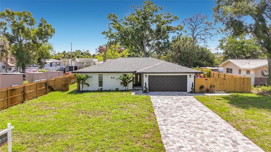 St Petersburg - Welcome to this beautifully reimagined 3-bedroom, 2-bath pool home nestled in the highly sought-after Lakewood Estates. Boasting 1,968 square feet of thoughtfully renovated living space, this home seamlessly blends modern design with effortless Florida living. Every detail has been thoughtfully curated for comfort and style, making it an ideal retreat for everyday living and effortless entertaining. From the moment you arrive, the inviting curb appeal and fresh exterior presentation set the tone for what awaits inside. Step inside to a light-filled, open-concept layout enhanced by sleek tile flooring throughout, recessed LED lighting, and clean contemporary finishes that create a cohesive and sophisticated atmosphere. The spacious living room, family room, and dining areas flow naturally together, providing the perfect setting for gatherings.  At the heart of the home, the stunning gourmet kitchen opens effortlessly to the main living space, allowing conversation and connection to continue uninterrupted. Modern design elements and thoughtful layout choices make this kitchen functional as well as stylish.  The primary suite serves as a true retreat, offering generous proportions, an expansive walk-in closet, and a stunning spa-inspired en suite bath. Designed with relaxation in mind, the bathroom showcases a large walk-in shower with custom tile and glass surround, and designer finishes that evoke a luxury resort experience. The two secondary bedrooms are spacious and share an updated guest bath complete with a walk-in custom tiled shower with a glass surround, a dual sink vanity, and a soaking tub. Step outside to discover your own private backyard oasis. A sparkling pool surrounded by a brand-new paver outdoor living space and lush tropical landscaping creates the ultimate outdoor environment. The fully fenced yard provides both privacy and peace of mind, making it perfect for entertaining, relaxing poolside, or enjoying Florida’s year-round sunshine. Additional major upgrades include a new roof (2026), updated windows (2026), fresh exterior paint (2026), epoxy garage floors (2026), new water heater (2026), new paver walking paths and driveway. Situated high and dry in Flood Zone X, this property offers added confidence and long-term value. Ideally located just minutes from downtown St Petersburg, award-winning Gulf beaches, parks, and the nearby St Petersburg Country Club and Golf Course. This home places you close to shopping, restaurants, and entertainment while maintaining a quiet neighborhood setting. Completely move-in ready and meticulously updated, this home truly checks every box - modern upgrades, prime location, and the lifestyle you’ve been waiting for. Schedule your private showing today and experience Florida living at its finest.