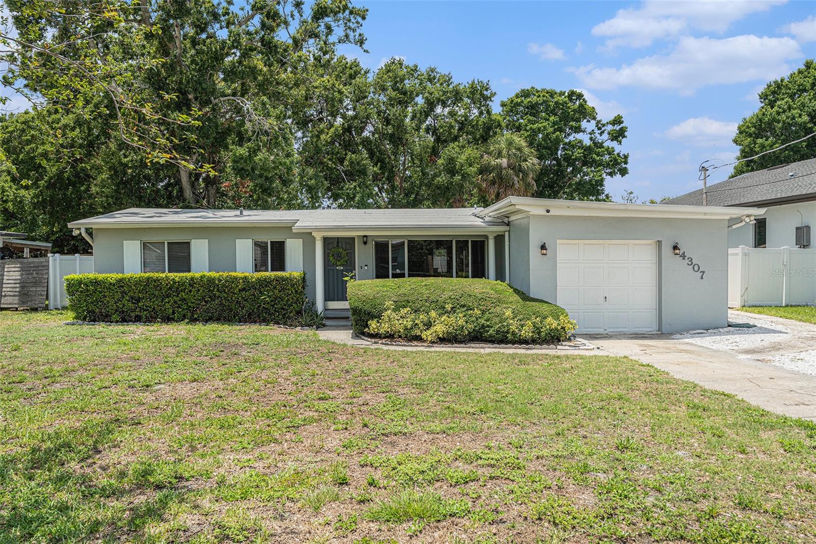 Nestled in the heart of Manhattan Manor, one of South Tampa’s most sought-after family-friendly neighborhoods, this beautifully updated 3-bedroom, 2-bath single-family pool home offers a rare combination of charm, space, and location. Featuring an oversized backyard perfect for entertaining, this home welcomes you with a formal living room that flows seamlessly into a remodeled open-concept kitchen and bright living area overlooking the private pool. A versatile bonus room off the kitchen can serve as a dining area, home office, or den. Skylights in the second bedroom and bathroom fill the space with natural light, while the attached garage includes a laundry area and extra storage. The driveway is scheduled to be repaired. Convenience is key, with a plethora of amenities nearby—including multiple grocery stores, gyms, restaurants, and bars all within blocks of the home. Enjoy top dining spots like Bern’s Steak House, Green Lemon, and The Blind Goat, or shop at Westshore Plaza, International Plaza, and Hyde Park Village. Just minutes from Downtown Tampa, St. Pete, and MacDill AFB, with easy access to I-275, the Selmon Expressway, and Gandy Bridge, commuting is a breeze. Families will love being just steps from the brand-new Kenneth E. Adum K-8 Magnet School, offering quality education only a couple of blocks away. Nearby, enjoy outdoor escapes along Bayshore Boulevard, Ballast Point Park, and Picnic Island, or head to Ben T. Davis, Clearwater, and St. Pete Beaches, and even Busch Gardens or Adventure Island for weekend fun. This residence offers the perfect balance of serenity and accessibility, delivering the quiet ambiance of a tranquil neighborhood while keeping you close to the vibrant energy of Tampa Bay. Don’t miss out on this unparalleled opportunity to experience the epitome of upscale living and claim your slice of paradise in South Tampa!