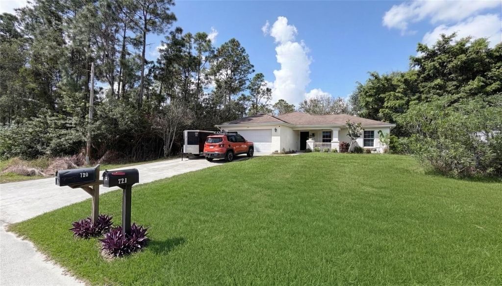 Photo of 720 Brannen Avenue, Lehigh Acres, FL 33974 (MLS # C7523597)