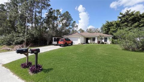 Photo of 720 Brannen Avenue, Lehigh Acres, FL 33974 (MLS # C7523597)